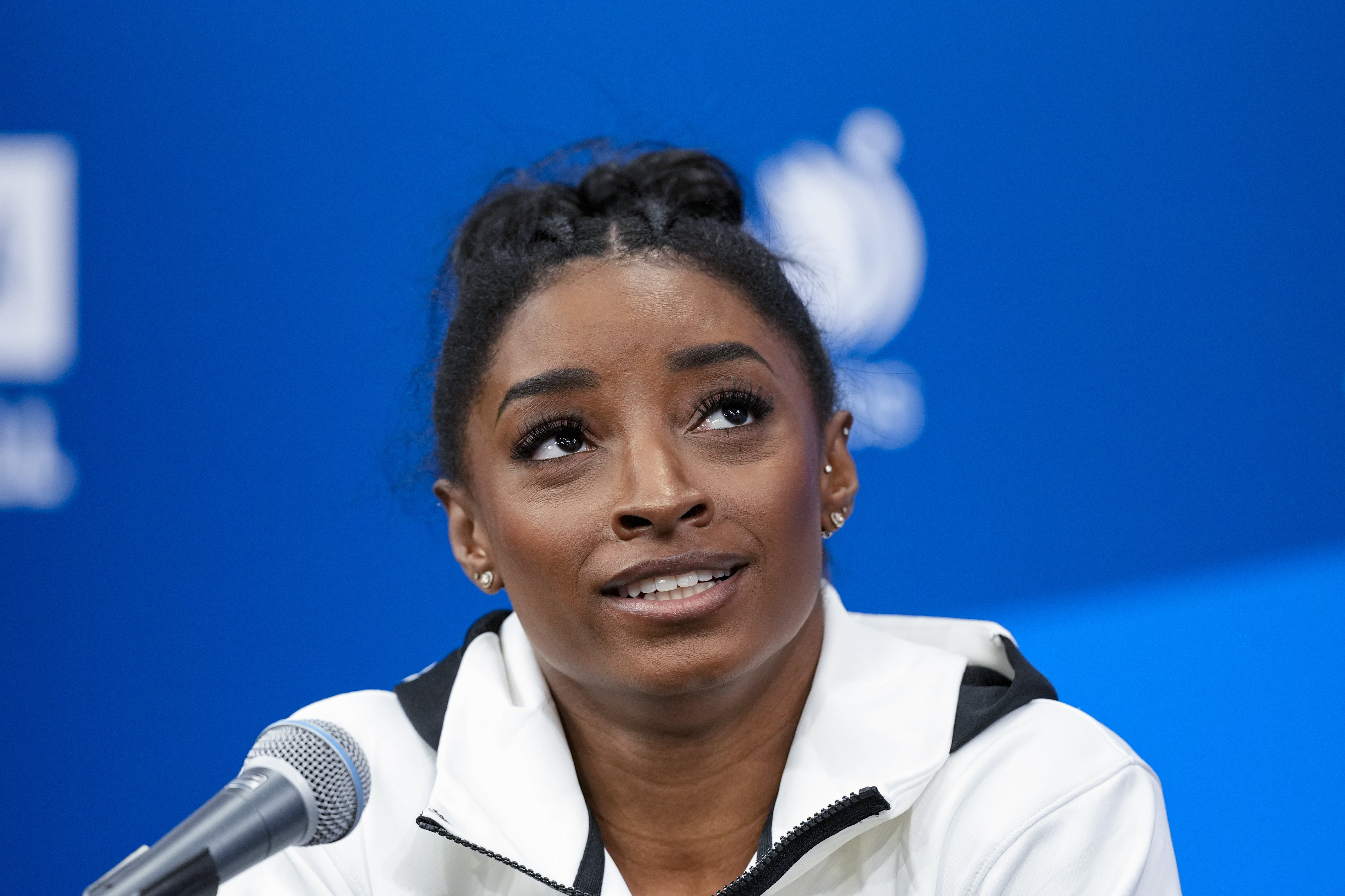 FILE - Simone Biles answers questions after she was named to the 2024 Olympic team at the United States Gymnastics Olympic Trials on June 30, 2024, in Minneapolis. Biles will compete at her third Olympics later this month in Paris. The 27-year-old won two medals in Tokyo three years ago despite removing herself from multiple finals to focus on her mental health.