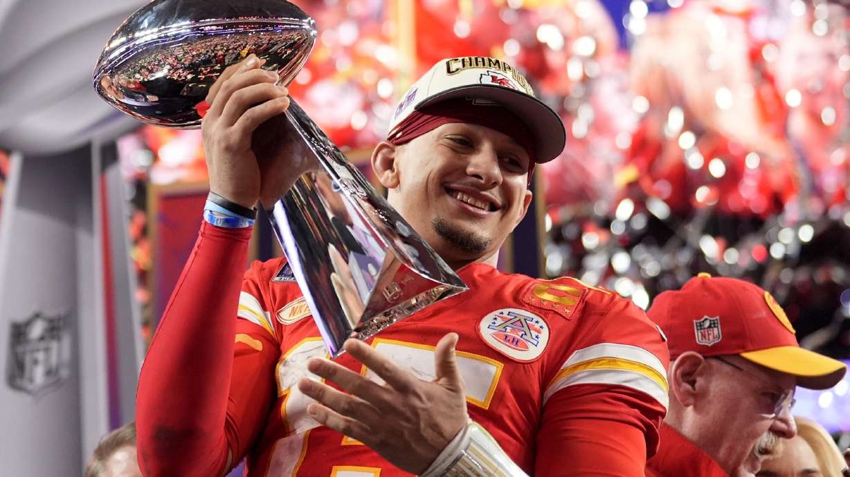 FILE - Kansas City Chiefs quarterback Patrick Mahomes celebrates with the trophy after the team's win in overtime during the NFL Super Bowl 58 football game against the San Francisco 49ers, Sunday, Feb. 11, 2024, in Las Vegas. Mahomes and the Chiefs are aiming to become the first team to three-peat since the 1965-67 Green Bay Packers won three consecutive NFL championships.
