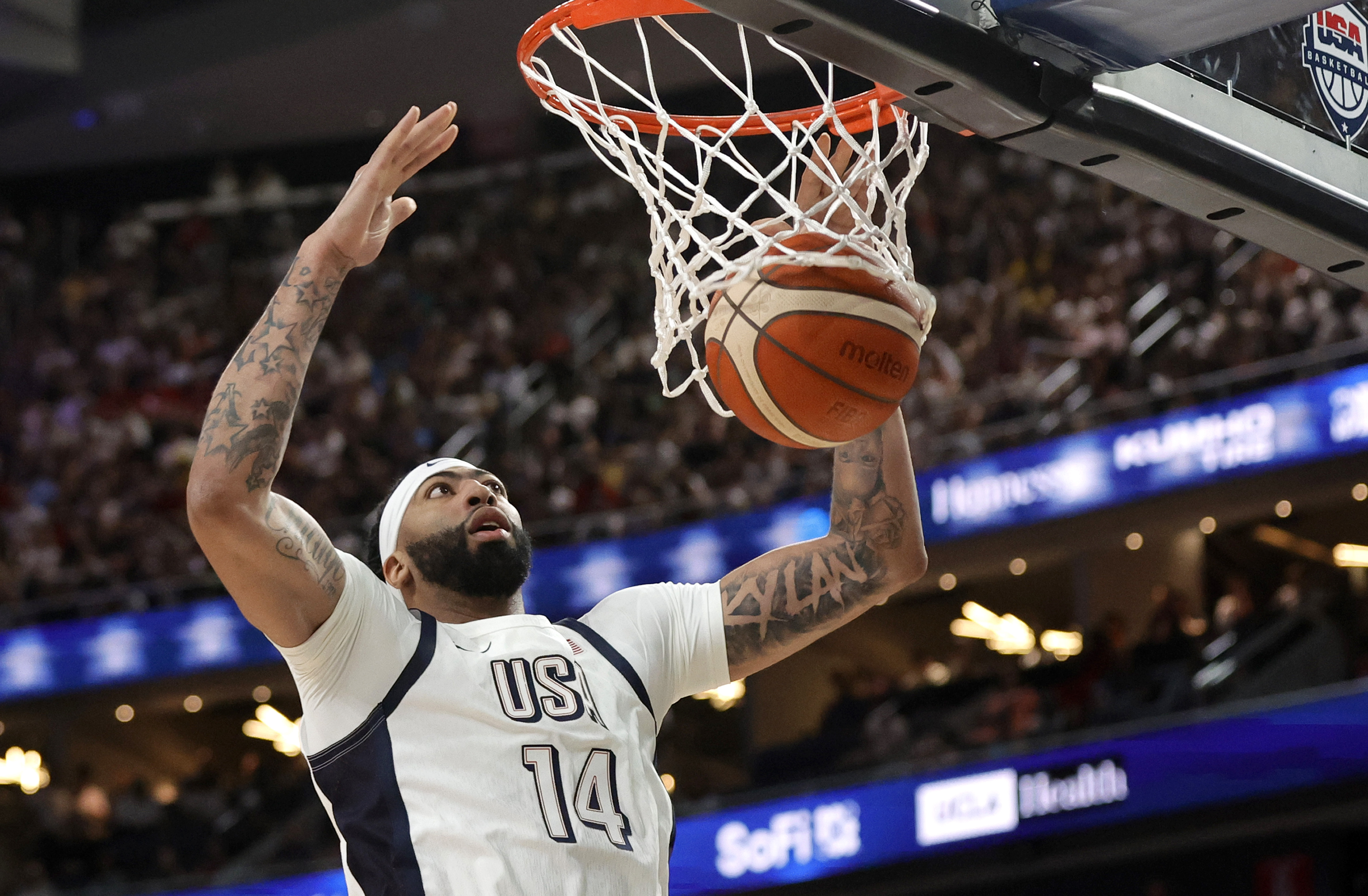 United States forward/center Anthony Davis (14) scores a basket during the first half of an exhibition basketball game against Canada, Wednesday, July 10, 2024, in Las Vegas.