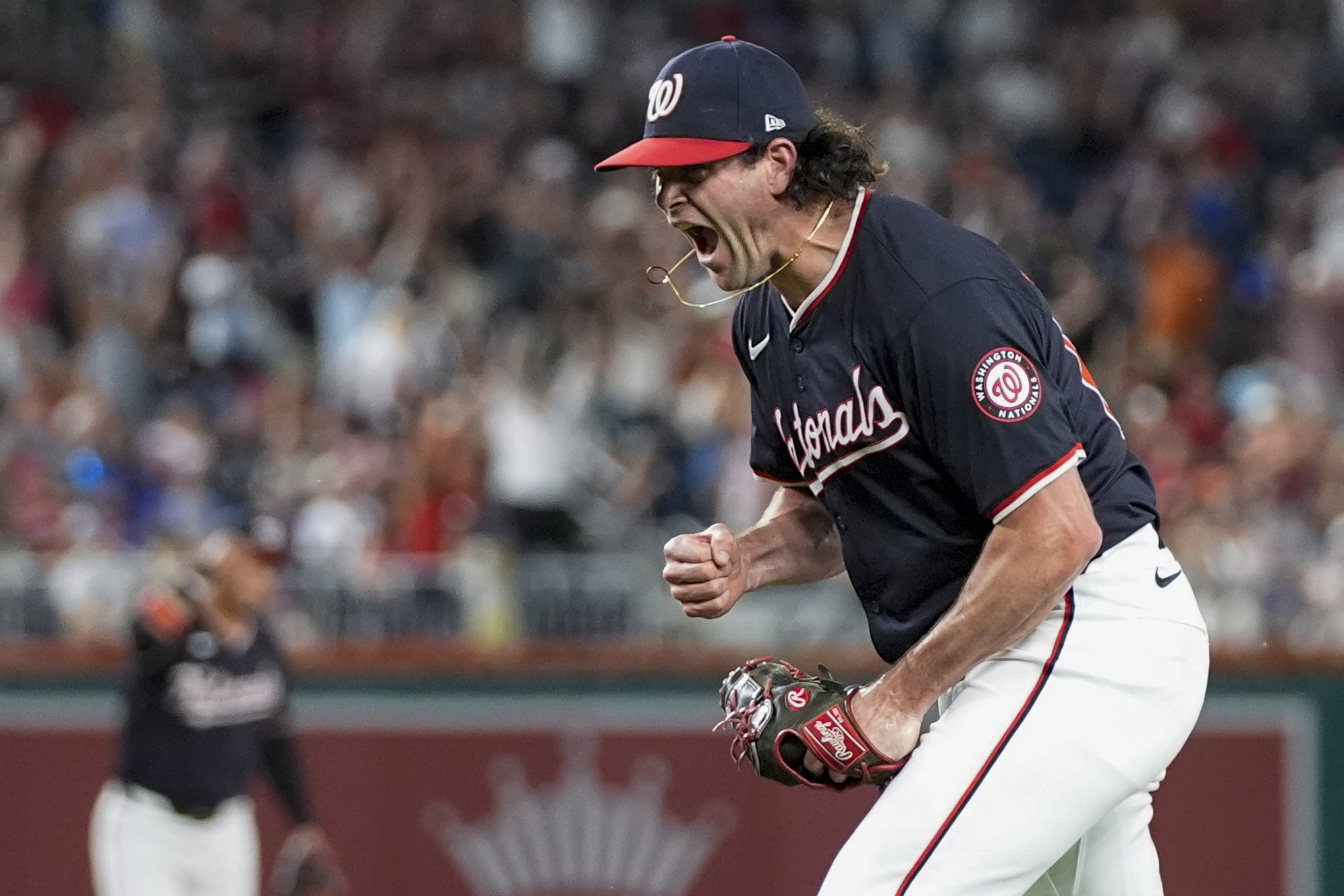 Washington Nationals pitcher Kyle Finnegan celebrates after the last out of a baseball game against the New York Mets at Nationals Park, Wednesday, July 3, 2024, in Washington. The Nationals won 7-5. 