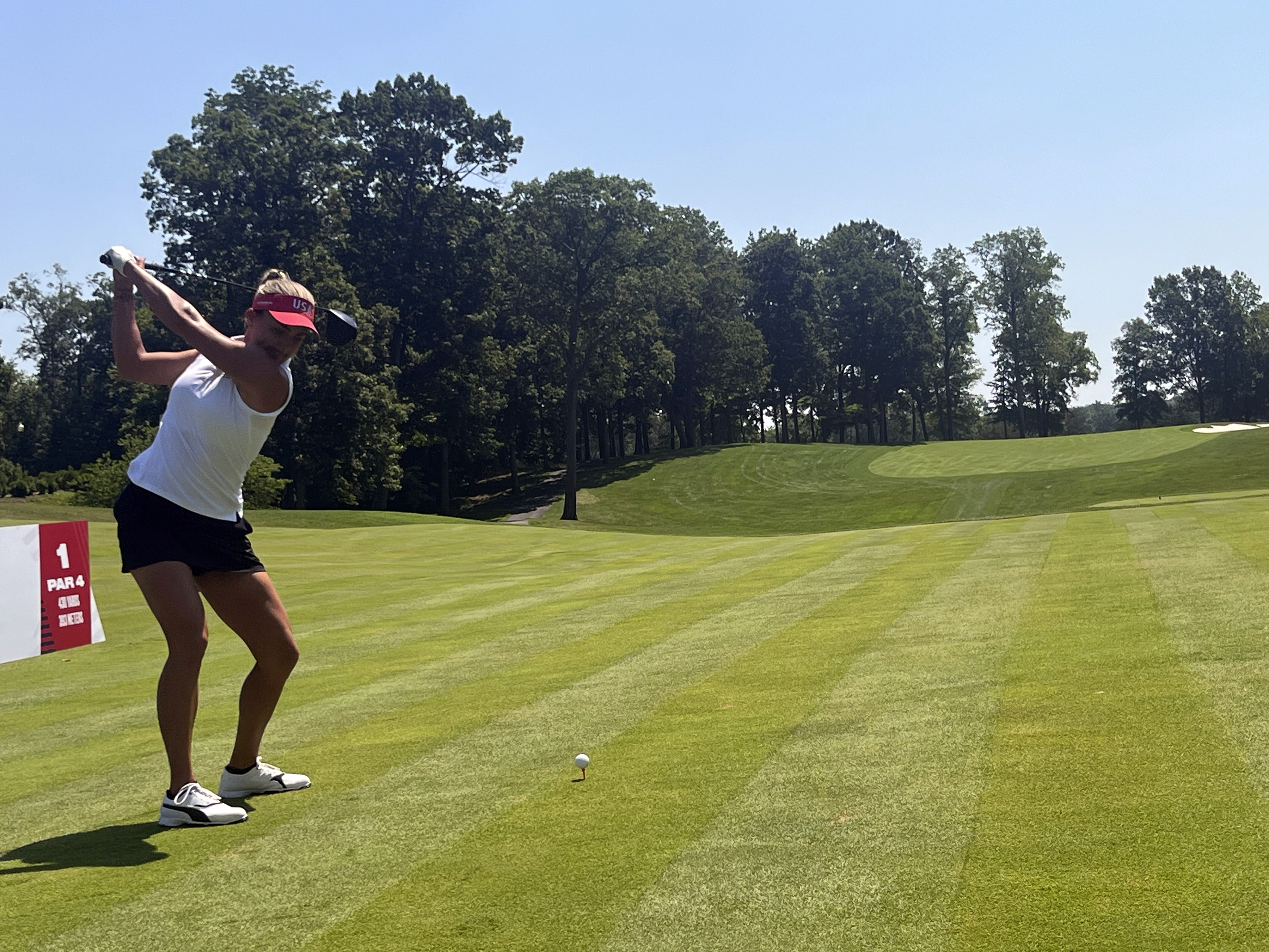 Lexi Thompson hits a ceremonial tee shot on the first hole at Robert Trent Jones Golf Club, Minday, July 15, 2024, in Gainesville, Va., where the United States will take on Europe in the Solheim Cup golf tournament in September.