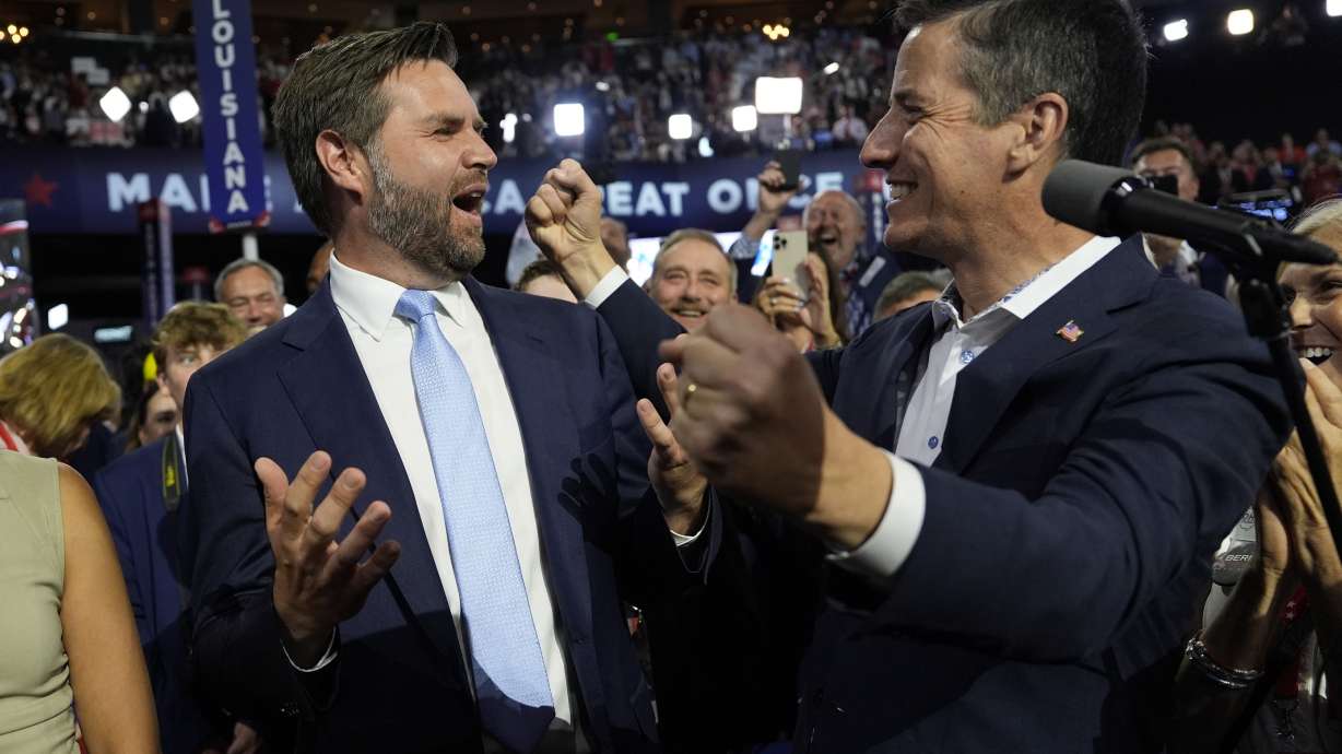 Republican vice presidential candidate Sen. JD Vance, R-Ohio, gestures toward Ohio Senate candidate Bernie Moreno, right, during the first day of the 2024 Republican National Convention at the Fiserv Forum, Monday in Milwaukee.