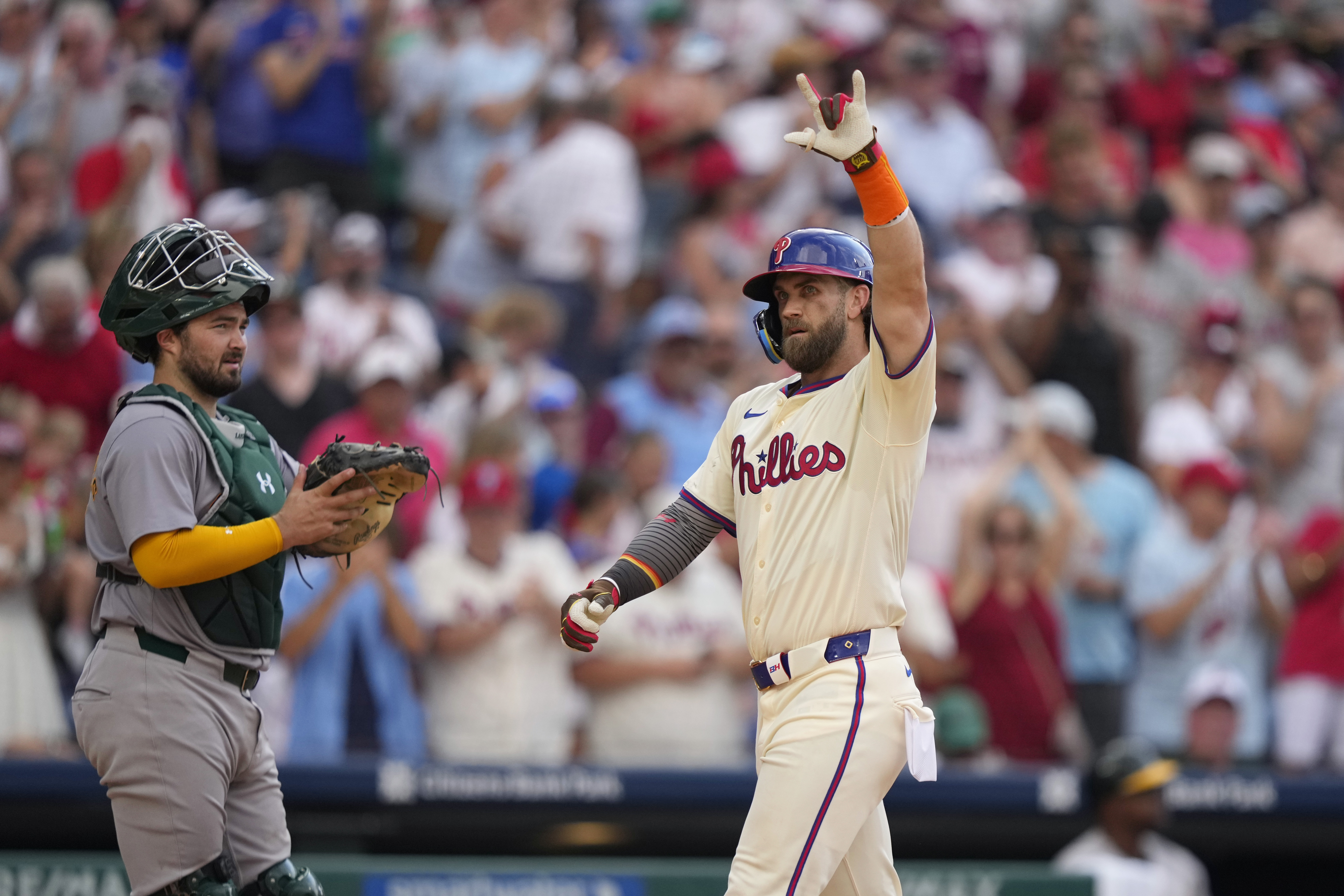 Philadelphia Phillies' Bryce Harper reacts after hitting a home run against Oakland Athletics pitcher Austin Adams during the seventh inning of a baseball game, Saturday, July 13, 2024, in Philadelphia.