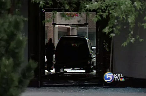 Woman Chases Man Through Building with SUV