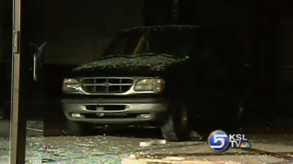 Woman Chases Man Through Building with SUV