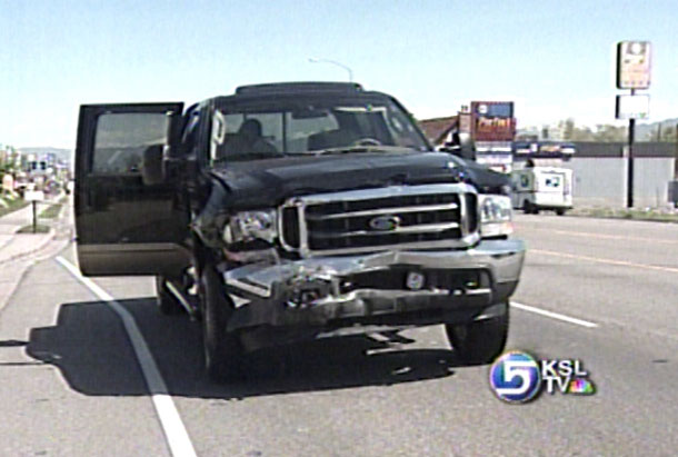 Truck Rolls Over Onto Body Shop Parking Lot