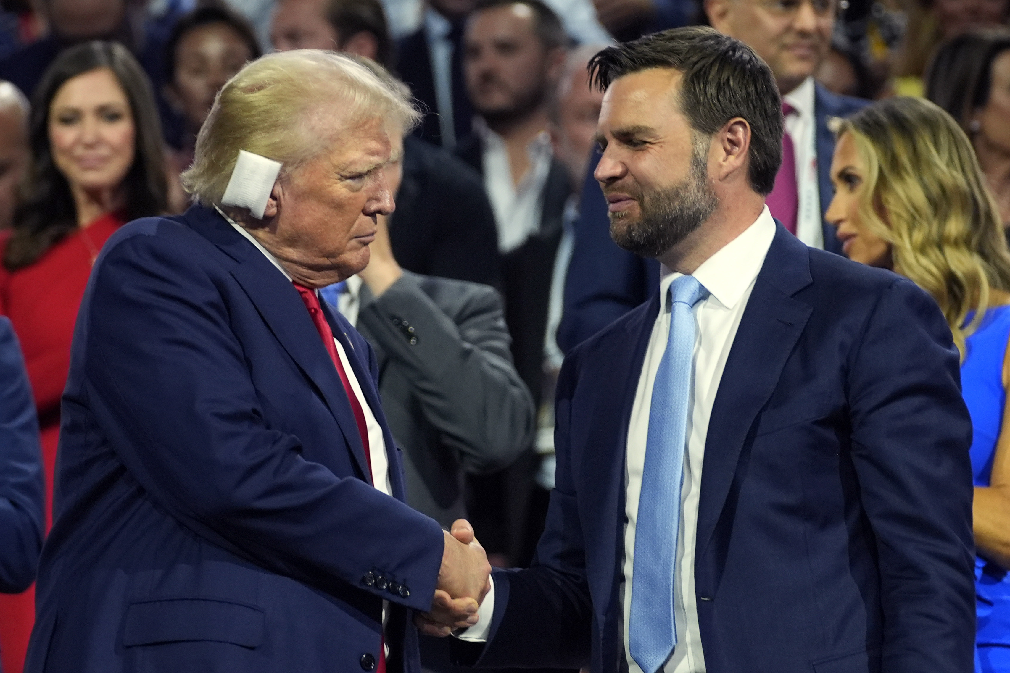 Republican presidential candidate former President Donald Trump and Republican vice presidential candidate Sen. JD Vance, R-Ohio, attend the first day of the Republican National Convention, Monday, in Milwaukee. The convention resumes with a focus on immigration Tuesday.