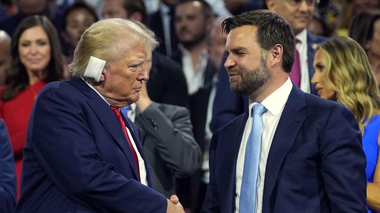 Republican presidential candidate former President Donald Trump and Republican vice presidential candidate Sen. JD Vance, R-Ohio, attend the first day of the Republican National Convention, Monday, in Milwaukee. The convention resumes with a focus on immigration Tuesday.