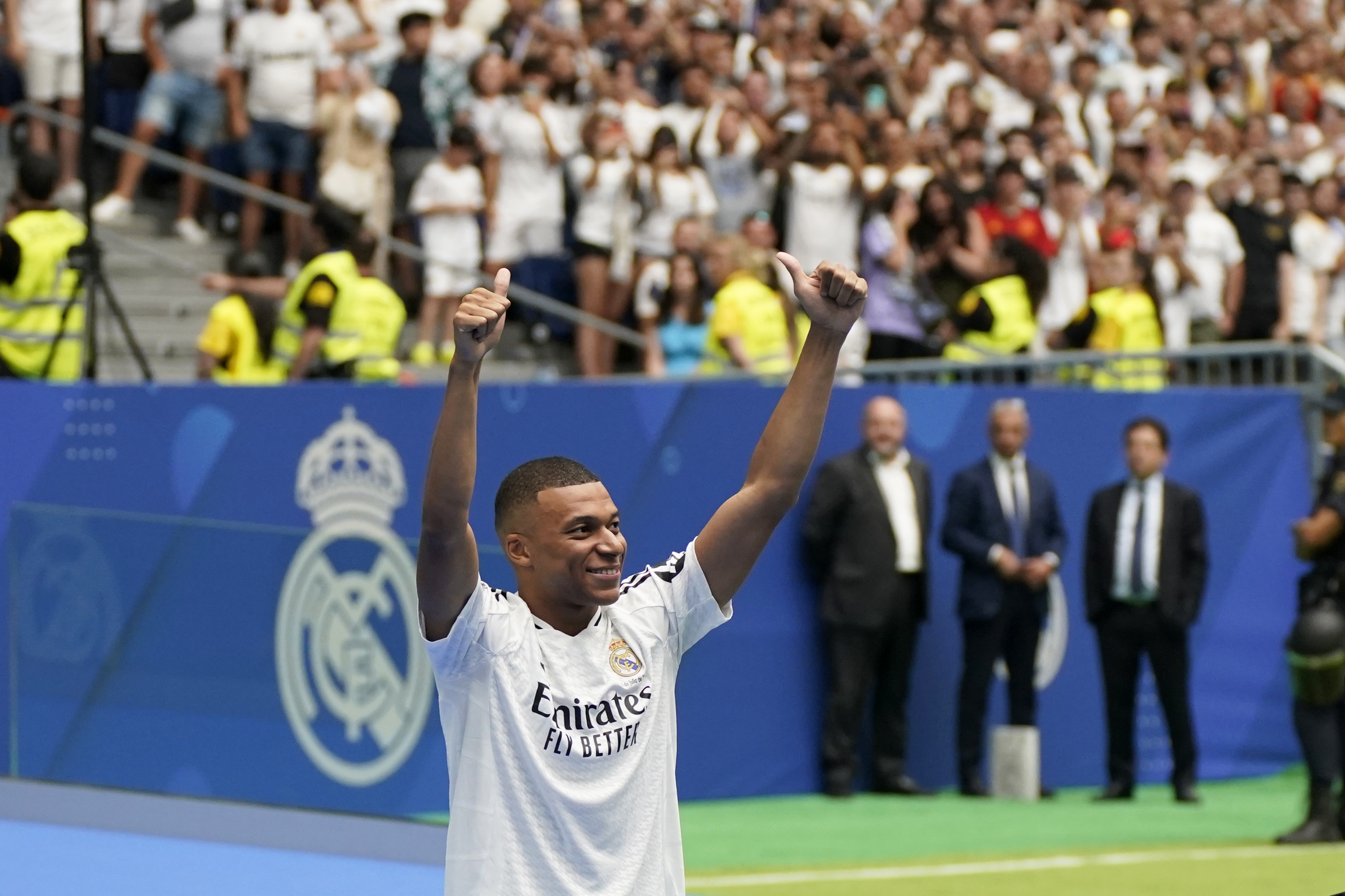 Kylian Mbappe, of France, gestures as he is presented to fans as a new Real Madrid player at the Santiago Bernabeu stadium in Madrid, Tuesday, July 16, 2024.