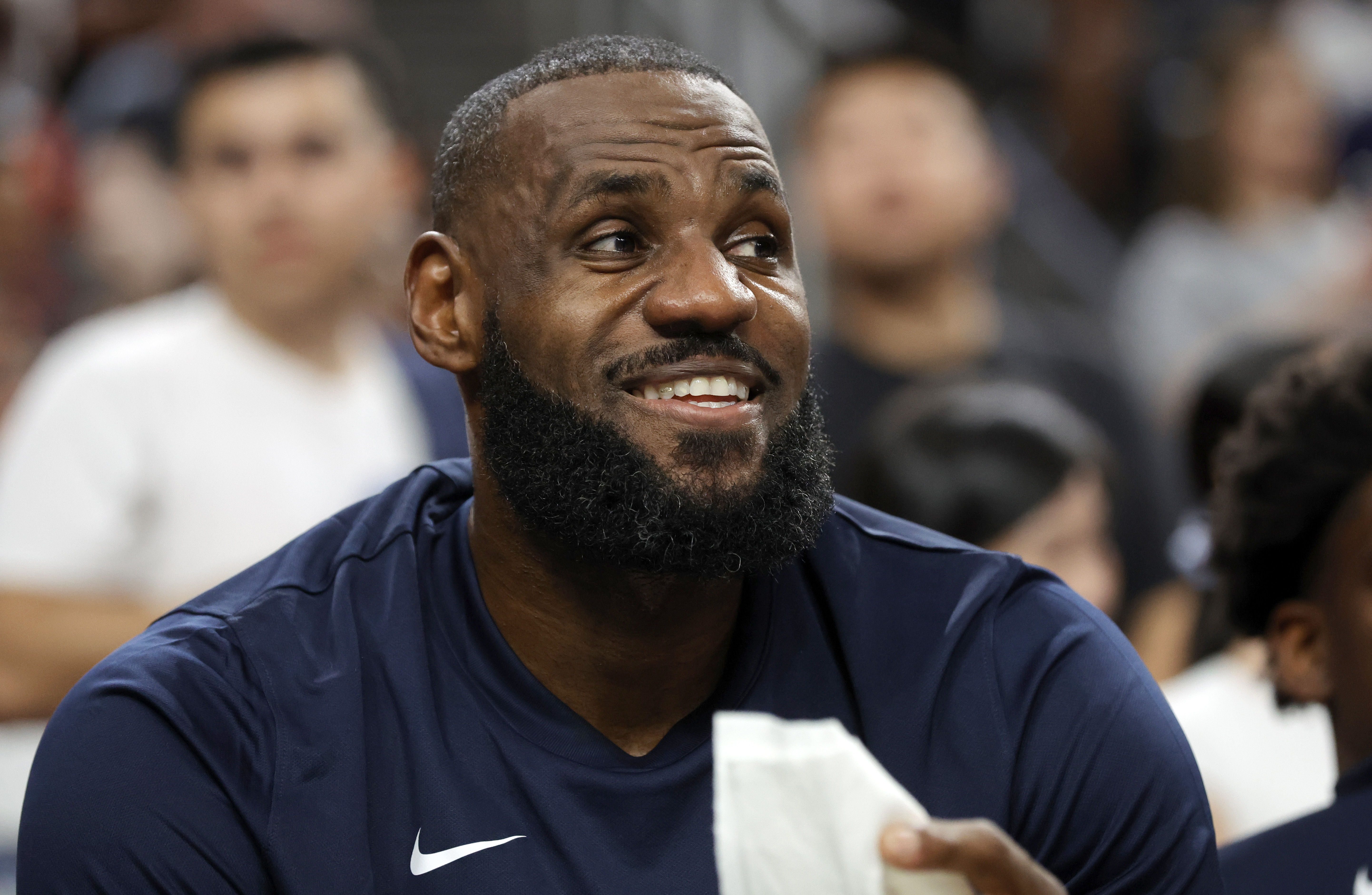 United States forward LeBron James watches play from the bench during the second half of an exhibition basketball game against Canada, Wednesday, July 10, 2024, in Las Vegas.