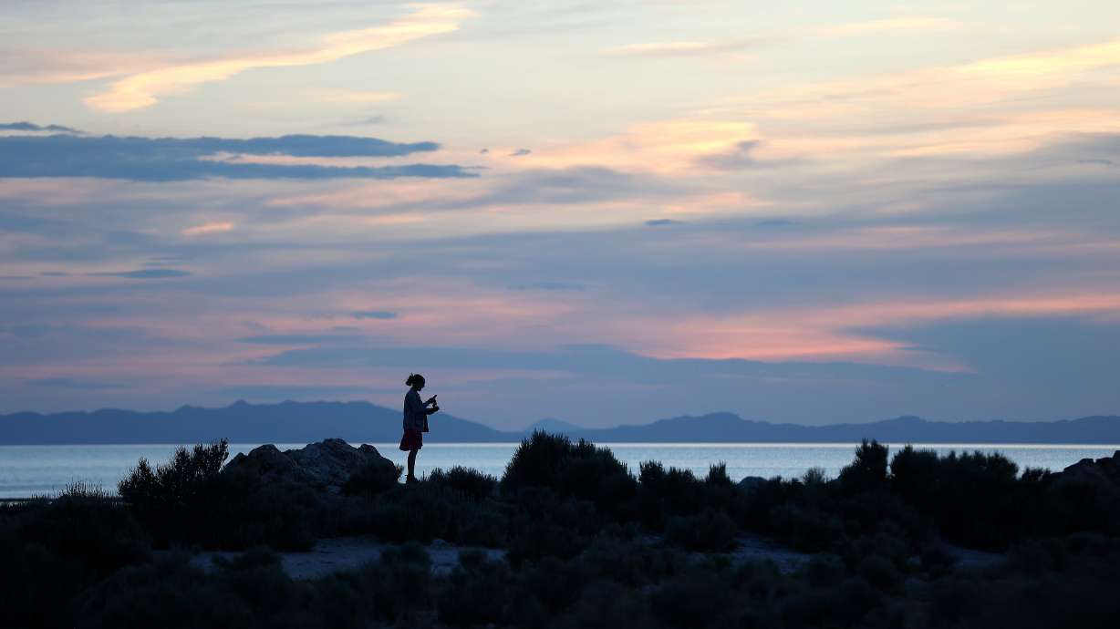 A woman hikes at Ladyfinger Point on Antelope Island June 5, 2023. The state issued Stage 2 fire restrictions for the state park that went into effect on Tuesday.