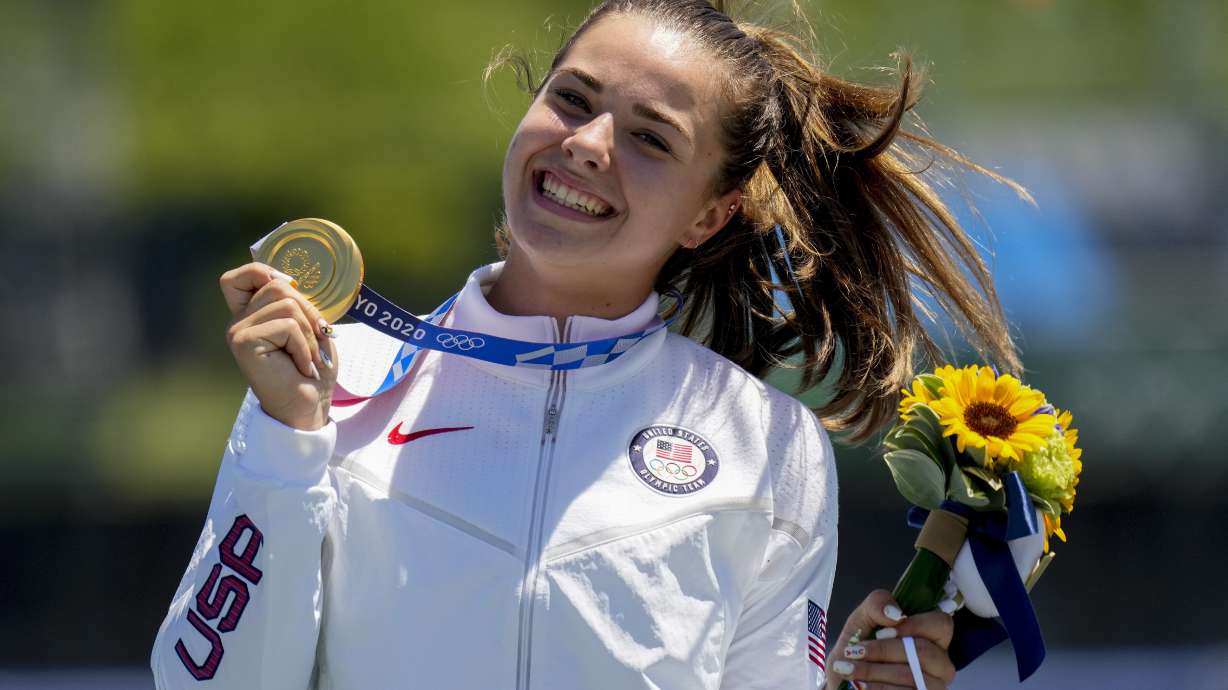 FILE - Nevin Harrison, of the United States, holds her up gold medal after winning the women's canoe single 200m final at the 2020 Summer Olympics, Thursday, Aug. 5, 2021, in Tokyo, Japan. Harrison is 22 years old and the defending Olympic gold medalist in canoe 200 sprint. She is a rock star in her sport and a certain threat to get back on the podium at the Paris Games.