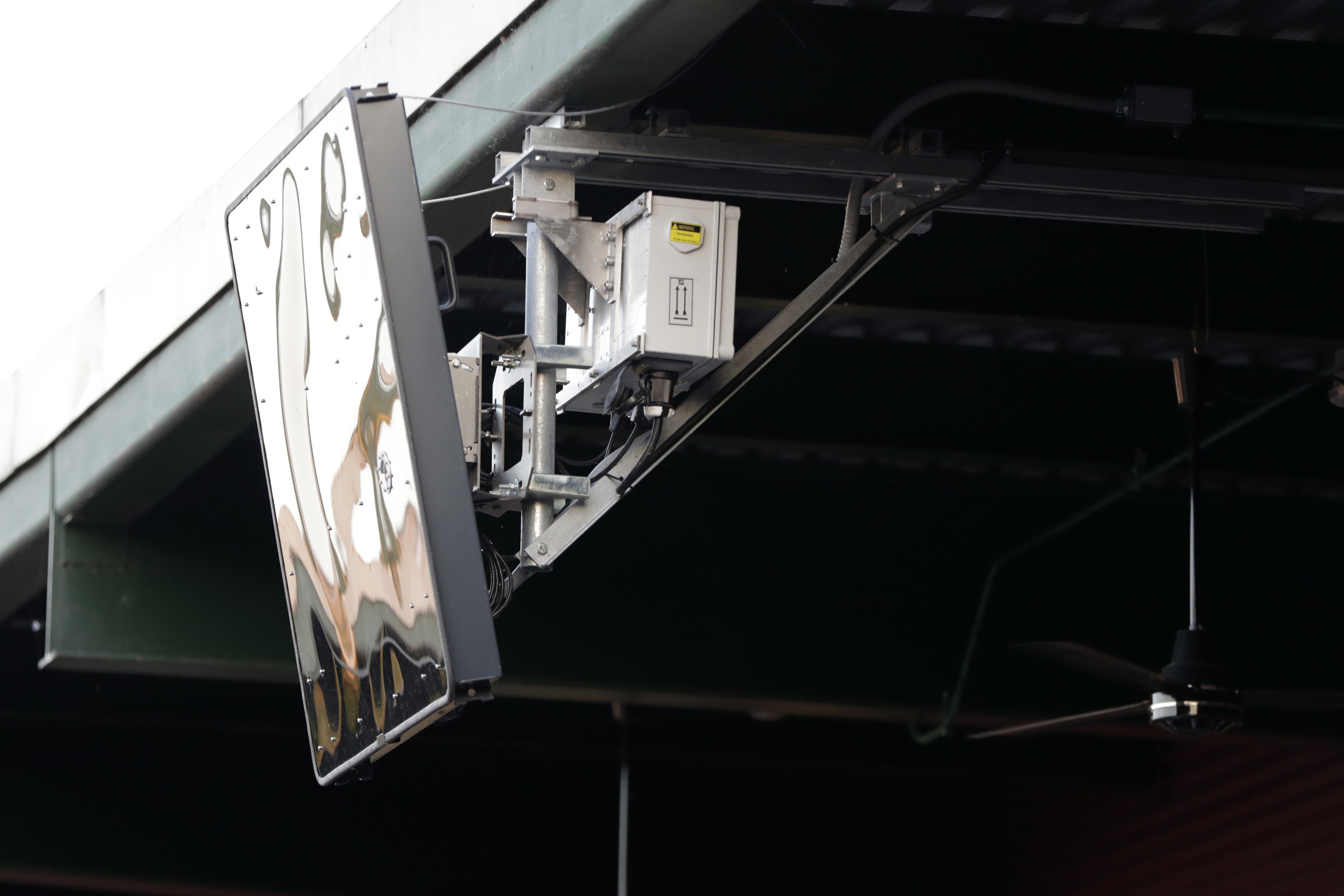 FILE - A radar device is seen on the roof behind home plate at PeoplesBank Park during the third inning of an Atlantic League All-Star minor league baseball game in York, Pa. Baseball's top minor leagues are switching to a challenge system full-time for their test of robot umpires. Major League Baseball has been experimenting with the automated ball-strike system in the minor leagues since 2019. 