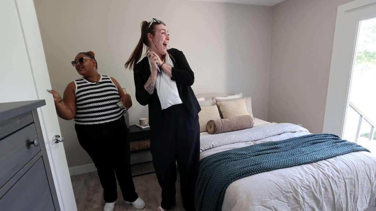 Maygan Martinez, Youth Action Board founder and former president, and Natalie Clark, Youth Action Board foster care liaison, check out a renovated Milestone Transitional Living Program house in Sandy on July 15.