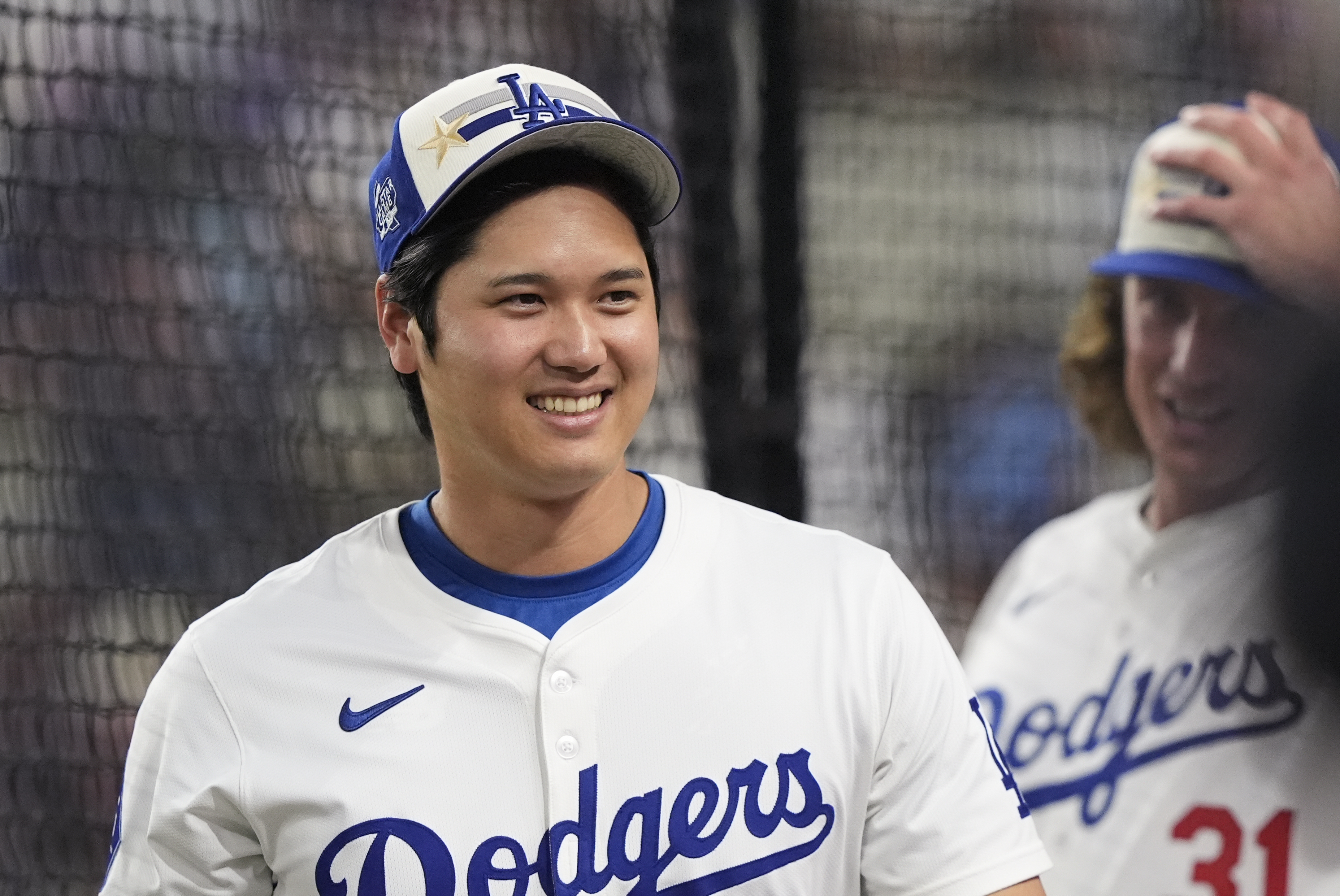 National League's Shohei Ohtani, of the Los Angeles Dodgers, smiles during the MLB baseball All-Star Home Run Derby, Monday, July 15, 2024, in Arlington, Texas. 