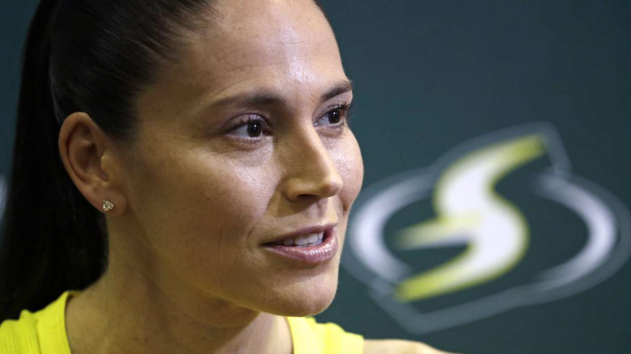 FILE - Seattle Storm's Sue Bird talks with media members at the basketball team's media day in Seattle, May 13, 2019. Magic Johnson's love of basketball motivated him to save the Los Angeles Sparks from folding and also put him on the leading edge of what is now a growing WNBA trend. Former WNBA players Sue Bird and Renee Montgomery have joined the ownership groups of the Seattle Storm and Atlanta Dream, respectively.