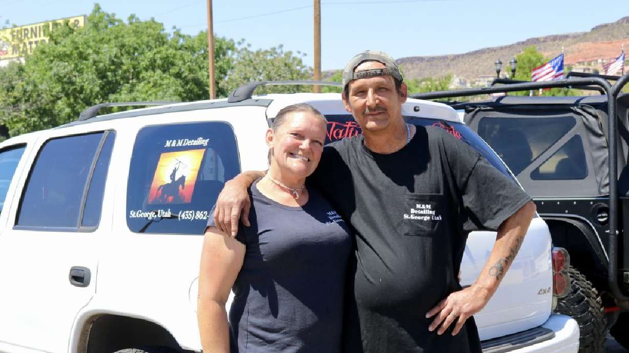M&M Detailing owners Marnie Abrahamson and Michael Lizotte smile together for a photo, St. George, June 17.