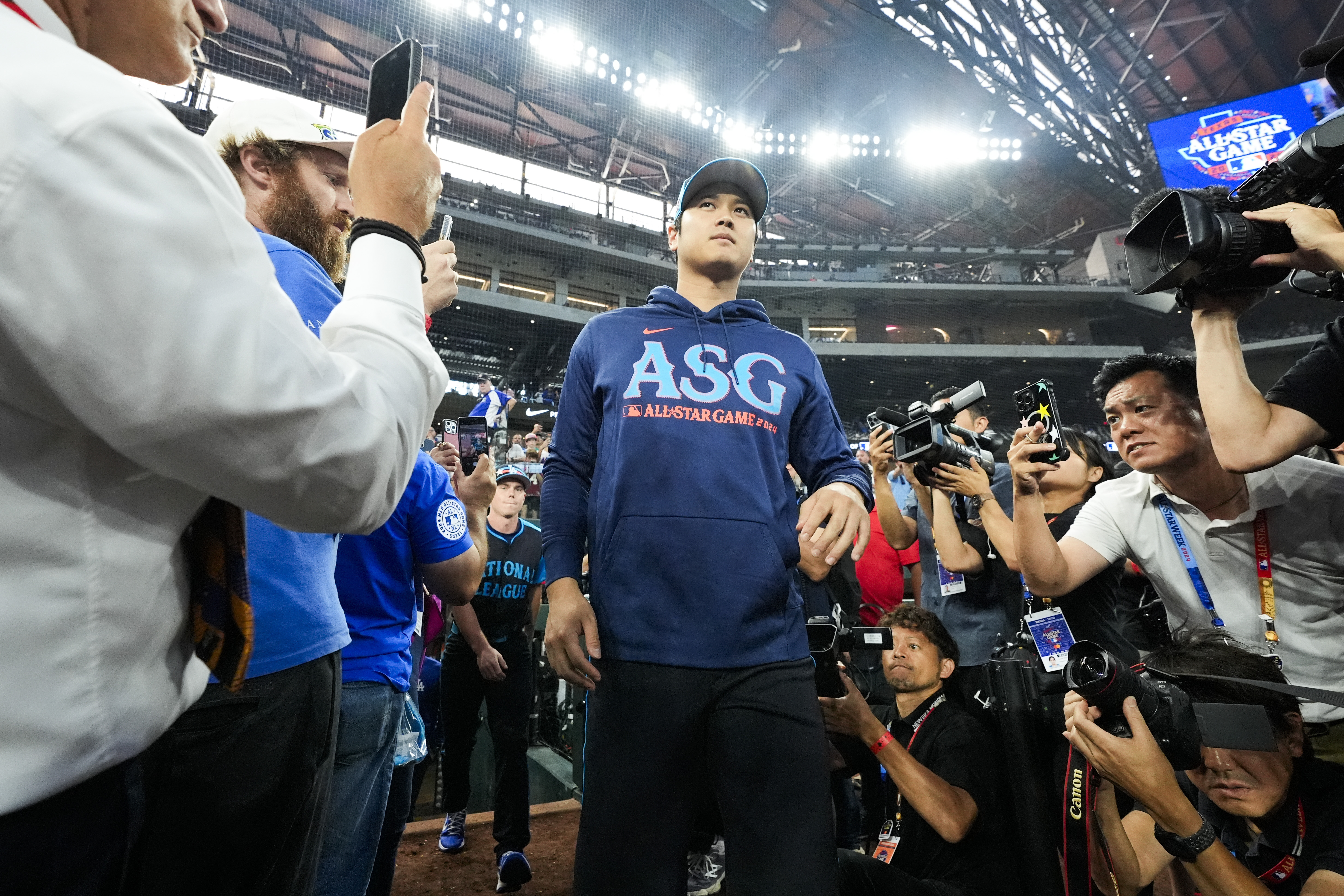 National League's Shohei Ohtani, of the Los Angeles Dodgers, walks on to the field before the MLB All-Star baseball game, Tuesday, July 16, 2024, in Arlington, Texas.