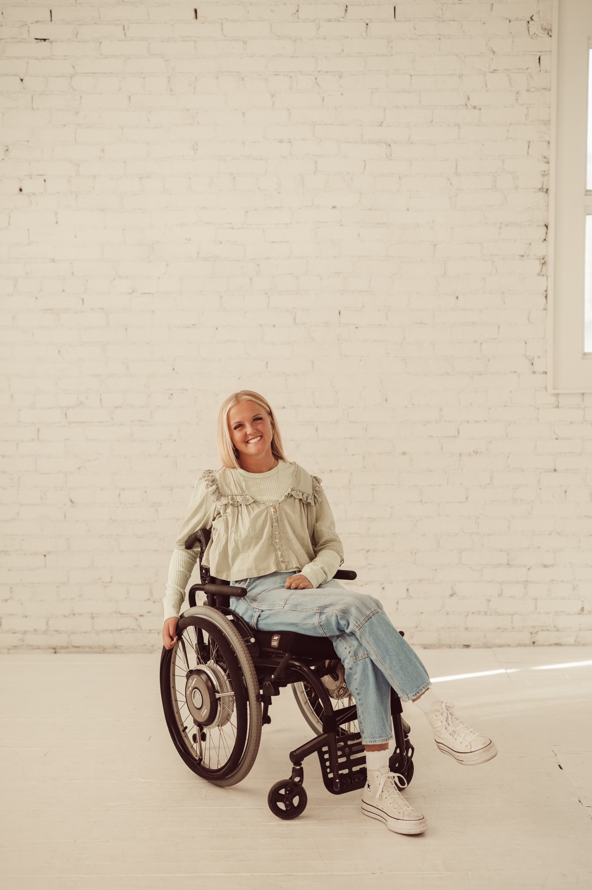 Emily Traveller, who was paralyzed from the waist down following an ATV accident in 2022, is a proponent of adaptive sports for people who have been injured and have limited mobility.