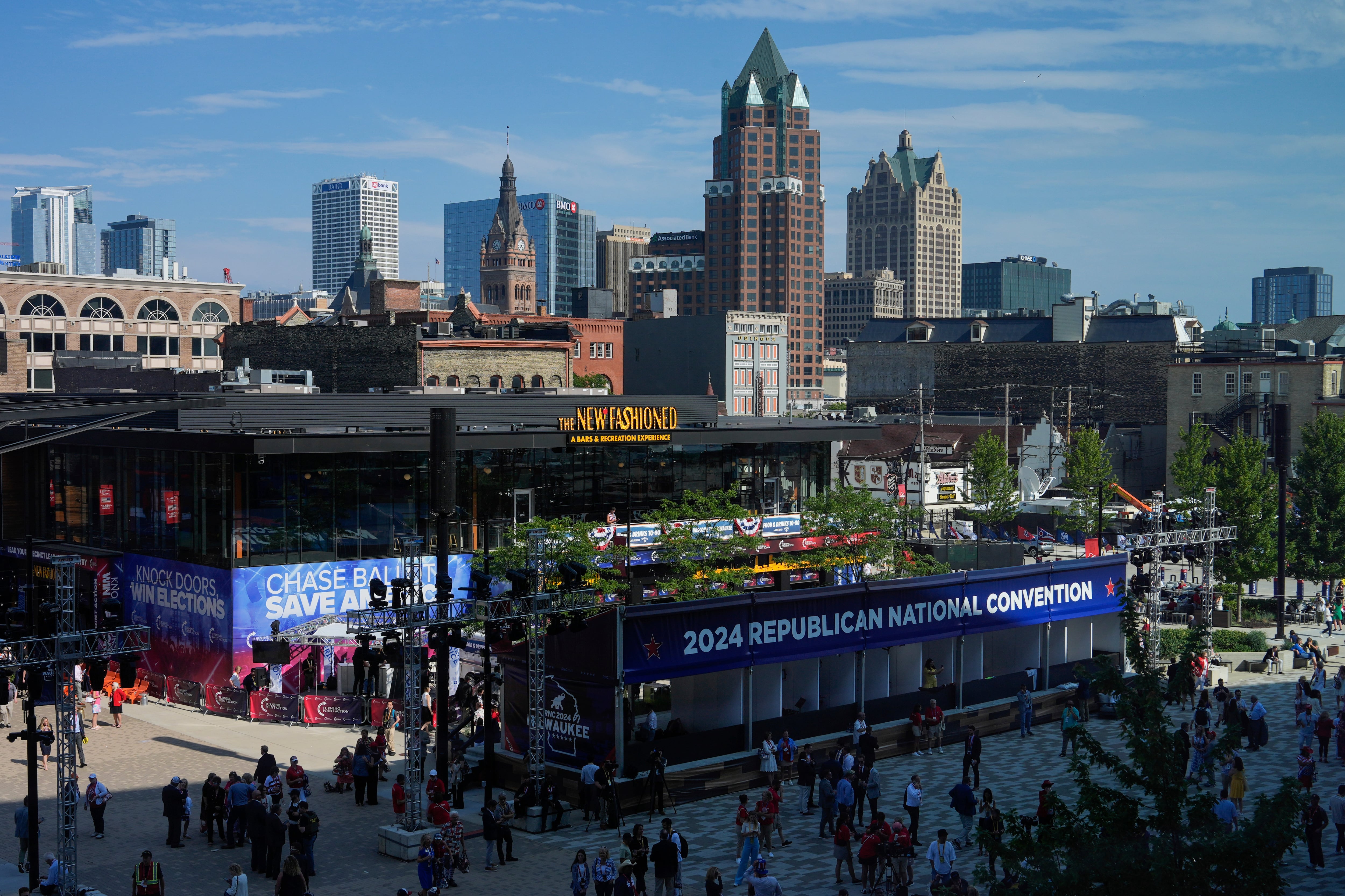 People arrive at the Republican National Convention Tuesday in Milwaukee.