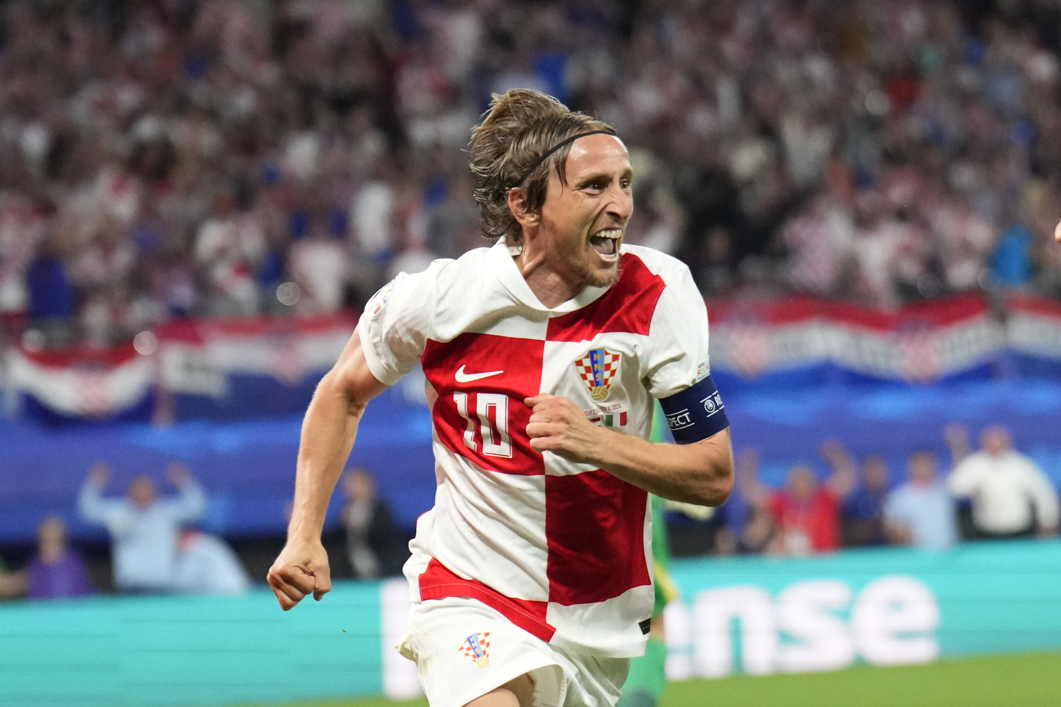 Croatia's Luka Modric celebrates after scoring his side's opening goal during a Group B match between Croatia and Italy at the Euro 2024 soccer tournament in Leipzig, Germany, Monday, June 24, 2024. 
