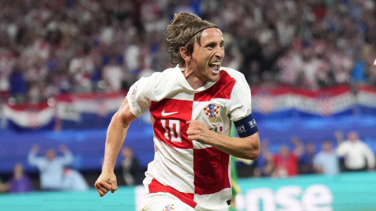 Croatia's Luka Modric celebrates after scoring his side's opening goal during a Group B match between Croatia and Italy at the Euro 2024 soccer tournament in Leipzig, Germany, Monday, June 24, 2024.