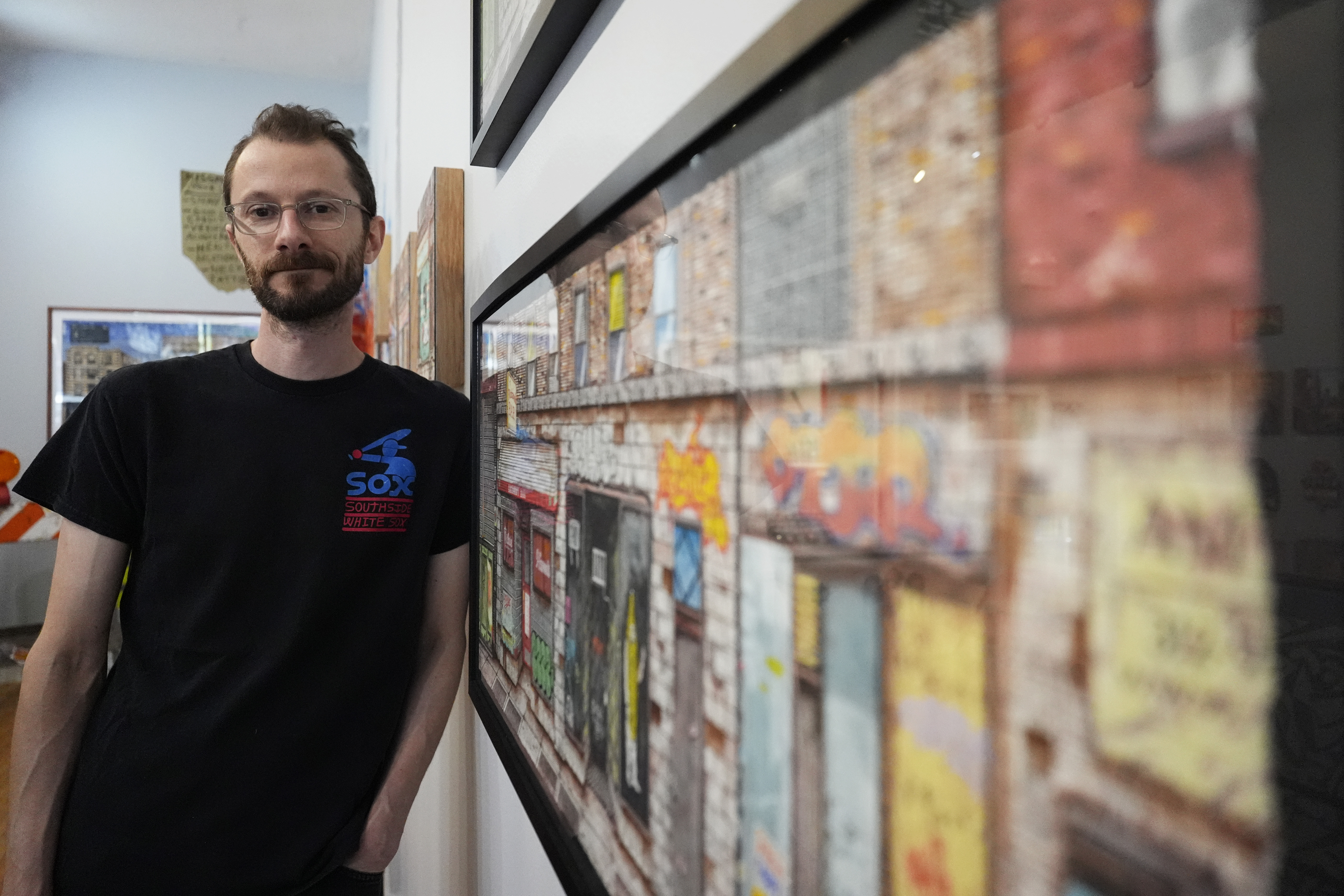 Zissou Tasseff-Elenkoff, the owner of All Star Press, poses for a photo at his gallery in Chicago, Thursday, June 27, 2024. Working with the local art gallery, the Chicago White Sox are rolling out 28 concert-style posters this season that were created by a total of 12 artists in Chicago and a couple more major league cities. 