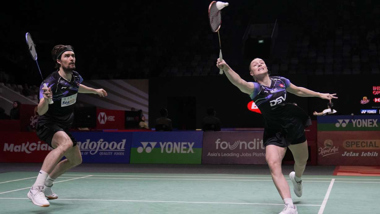 FILE - Denmark's Mathias Christiansen, left, and Alexandra Boje play mixed doubles against Japan's Yuta Watanabe and Arisa Higashino during the Indonesia Open badminton tournament Wednesday, June 5, 2024, at Istora Stadium in Jakarta, Indonesia. The Badminton World Federation confirmed Wednesday, July 17, that Christiansen has withdrawn from the Paris Olympics.