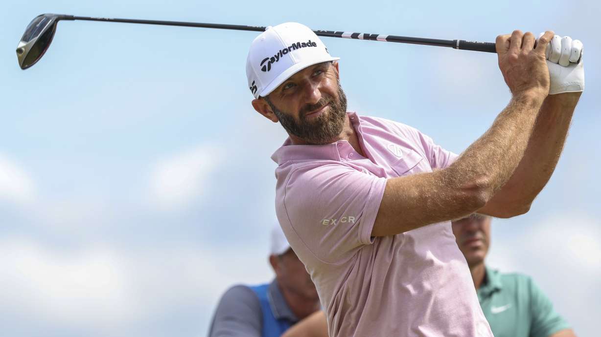 Dustin Johnson of the United States hits off the 13th tee during a practice round ahead of the British Open Golf Championships at Royal Troon golf club in Troon, Scotland, Wednesday, July 17, 2024.