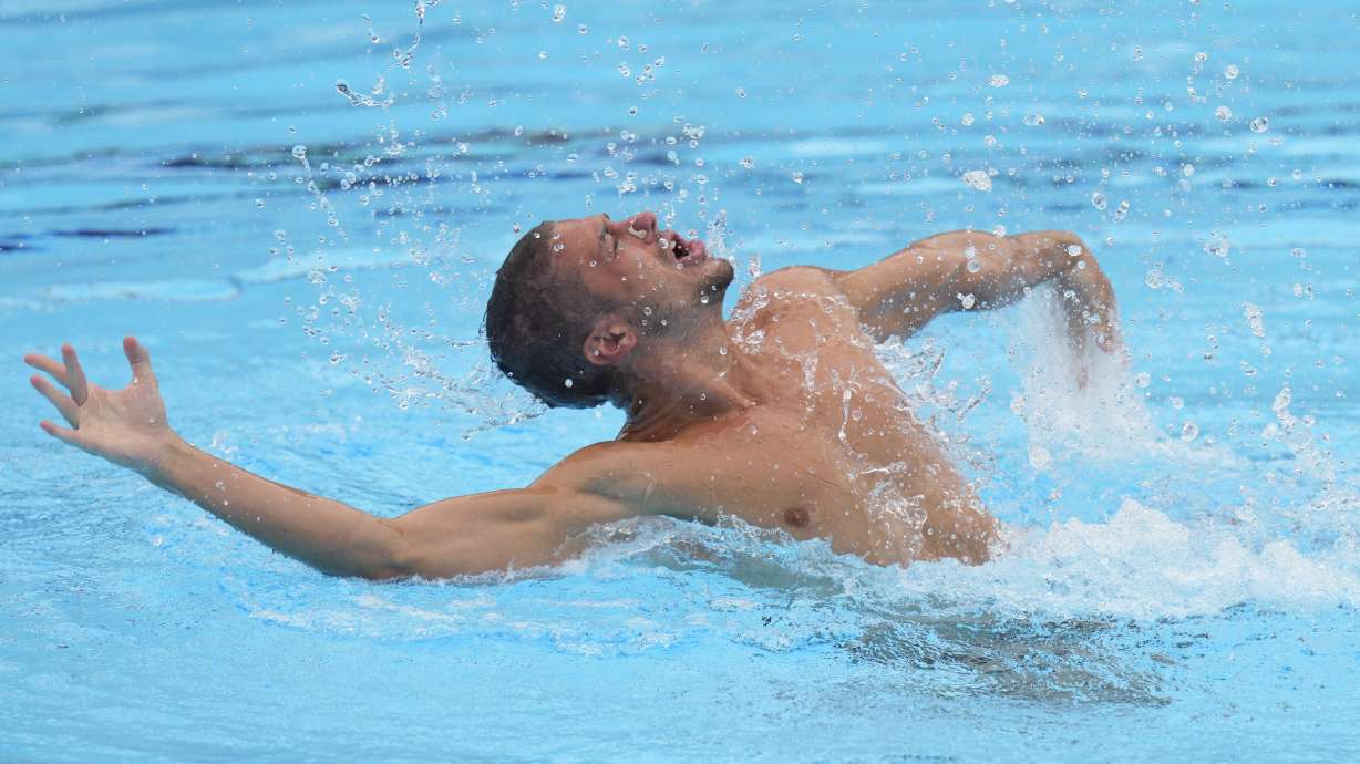 FILE - Italy's Giorgio Minisini competes during men's solo free final event at the European Aquatics Championships in Belgrade, Serbia, Thursday, June 13, 2024. With no men picked to compete in artistic swimming at the Paris Olympics, where they are eligible for the first time, a former world champion is ending his career this week. At the Italian national championships, four-time worlds gold medalist Giorgio Minsini is competing for the last time at age 28.