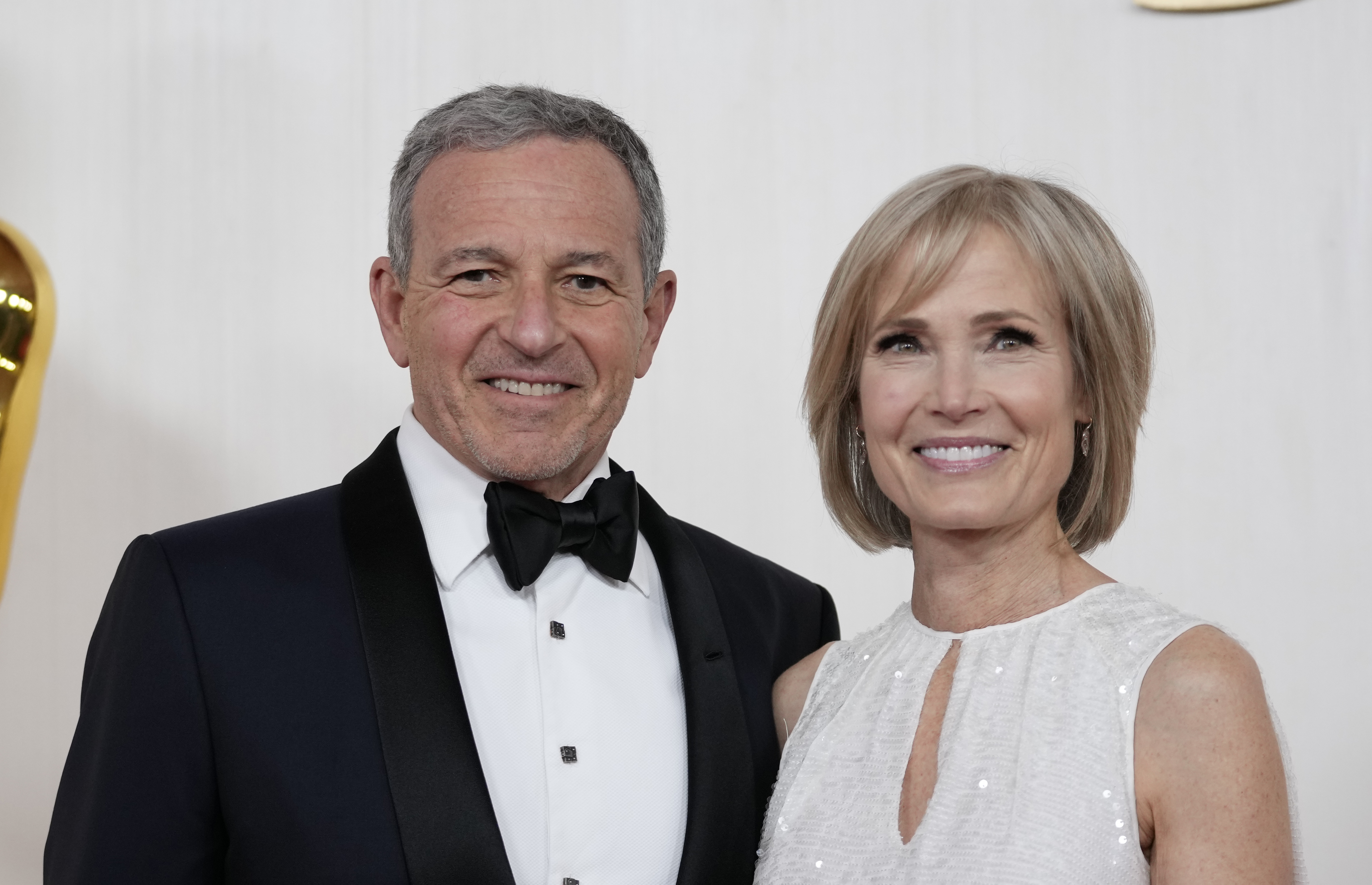 FILE - Bob Iger, left, and Willow Bay arrive at the Oscars on Sunday, March 10, 2024, at the Dolby Theatre in Los Angeles. Angel City FC announced Wednesday, July 17, 2024, that Walt Disney Company CEO Bob Iger and Southern California dean for communication and journalism Willow Bay will be the new controlling owners of what the franchise calls the most valuable women’s sports team in the world.