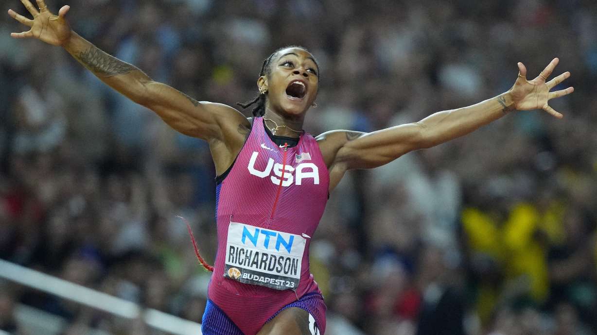 FILE - Sha'Carri Richardson, of the United States, celebrates after winning the gold medal in the final of the Women's 100-meters during the World Athletics Championships in Budapest, Hungary, Aug. 21, 2023.