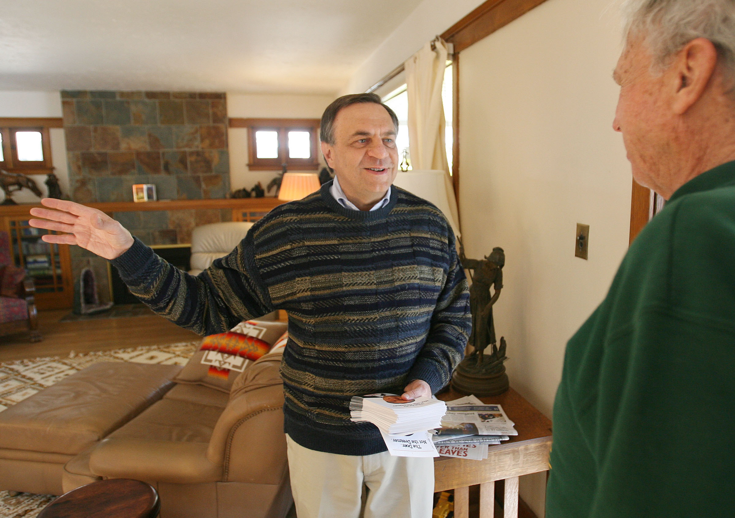 Dave Buhler talks with Keith Slatore during Buhler's 2007 Salt Lake City mayoral campaign. Buhler, Utah's former commissioner of higher education and longtime politician, has died at the age of 67.