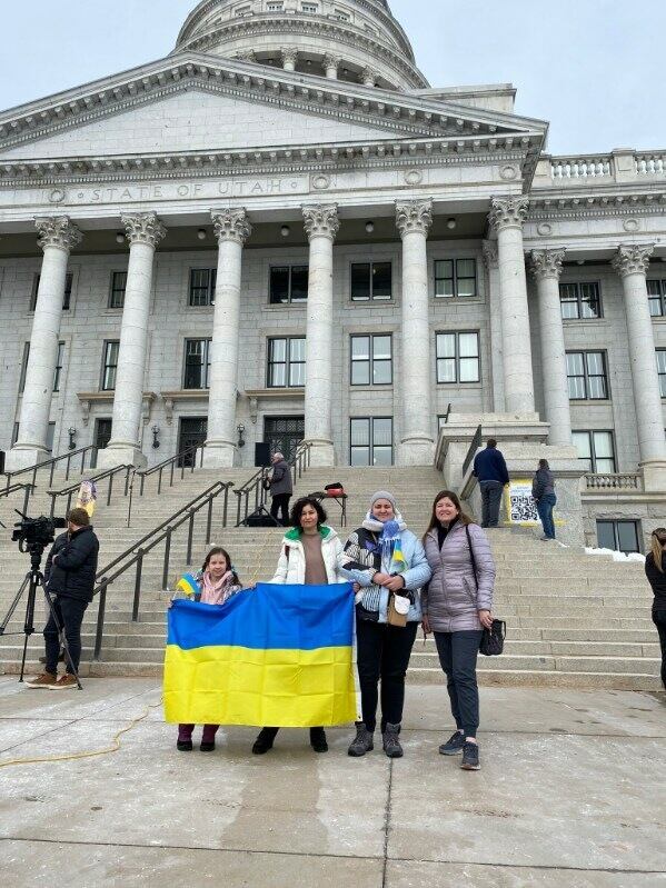 From left, Hanna, Marianna and Carrie Lindscott, a member of the local WelcomeNST team, attend a rally at the Utah State Capitol marking a year of the Russia-Ukraine war on Feb. 25, 2023. Lindscott served her mission in Ukraine, and helped Ukrainians Hanna and Marianna navigate life in the U.S.