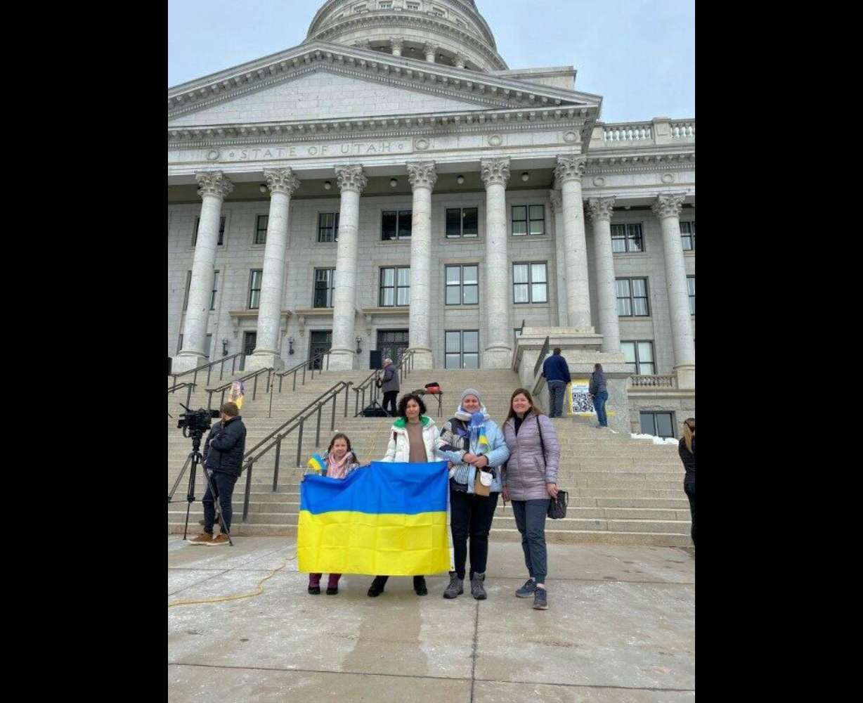 From left, Hanna, Marianna and Carrie Lindscott, a member of the local WelcomeNST team, attend a rally at the Utah State Capitol marking a year of the Russia-Ukraine war on Feb. 25, 2023. Lindscott served her mission in Ukraine, and helped Ukrainians Hanna and Marianna navigate life in the U.S.