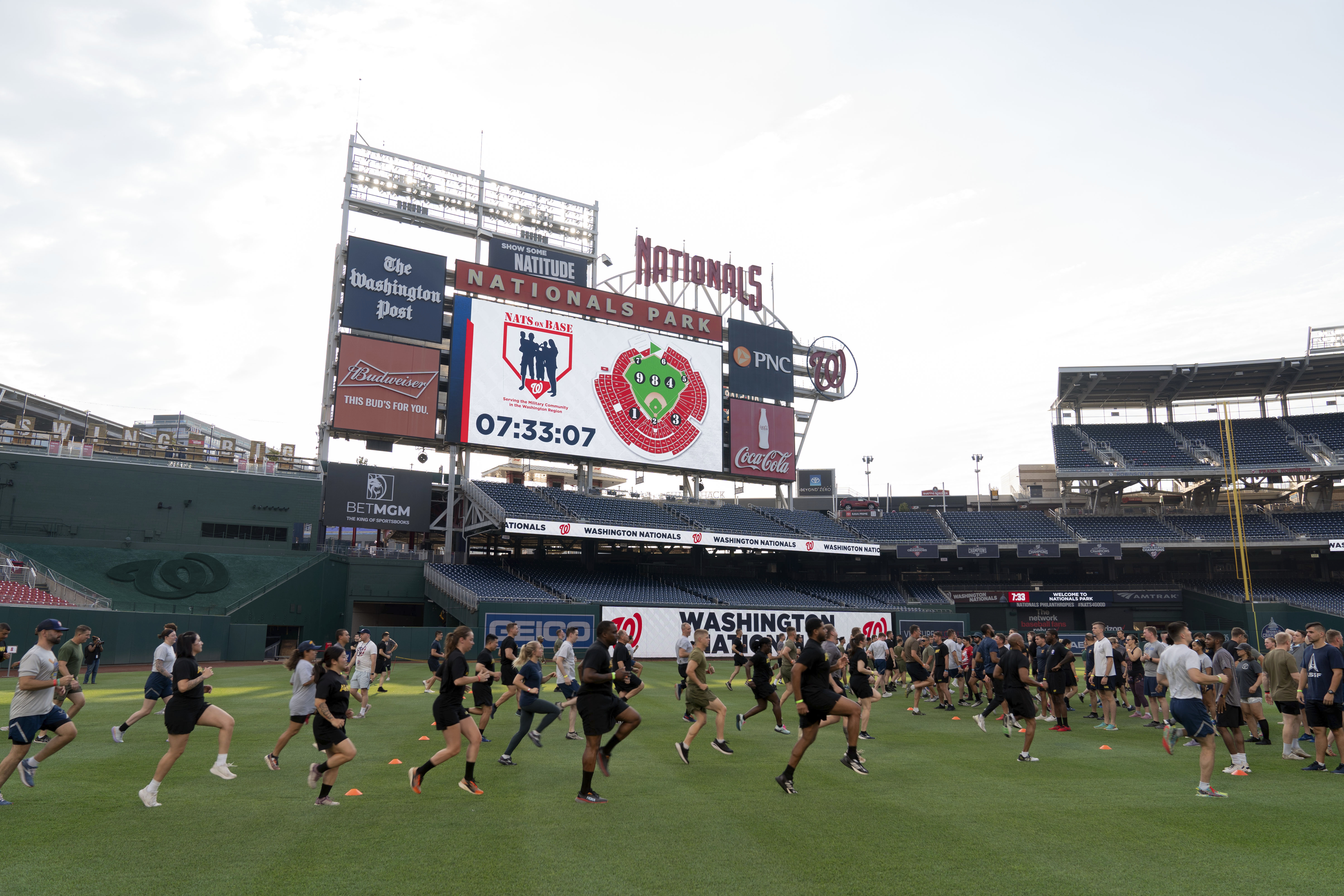 Military service members workout during the high intensity interval training for members of the military at Nationals Park, Tuesday, July 16, 2024 in Washington. 