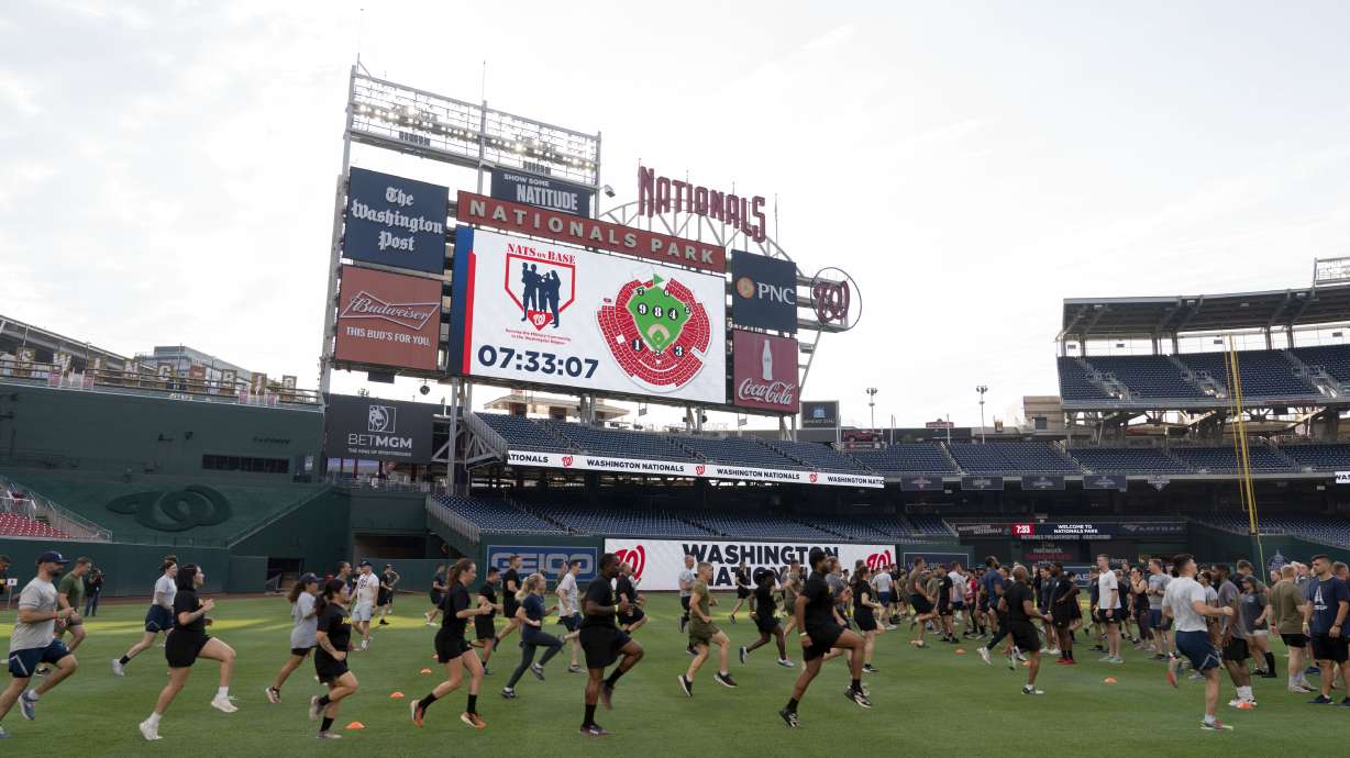 Military service members workout during the high intensity interval training for members of the military at Nationals Park, Tuesday, July 16, 2024 in Washington.