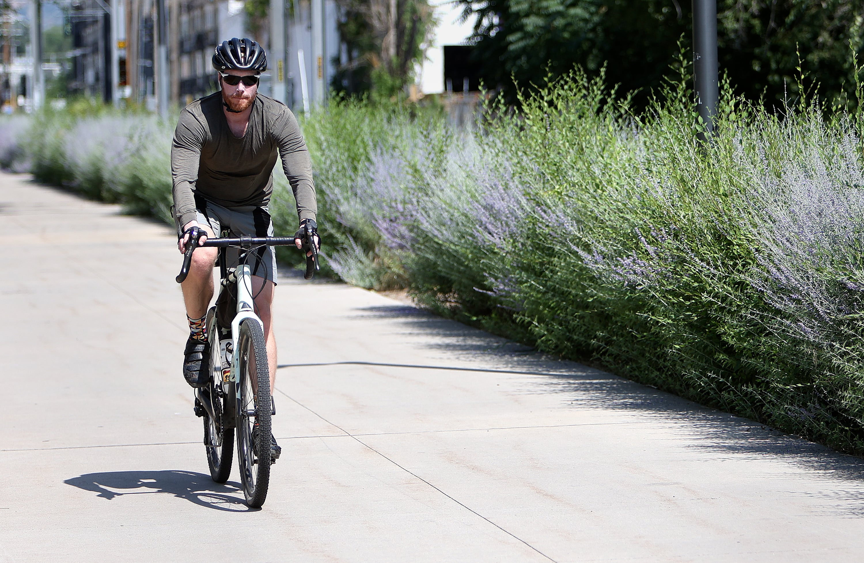 A man rides his bike along the S-Line Greenway section of Parley's Trail in Salt Lake City on Wednesday.