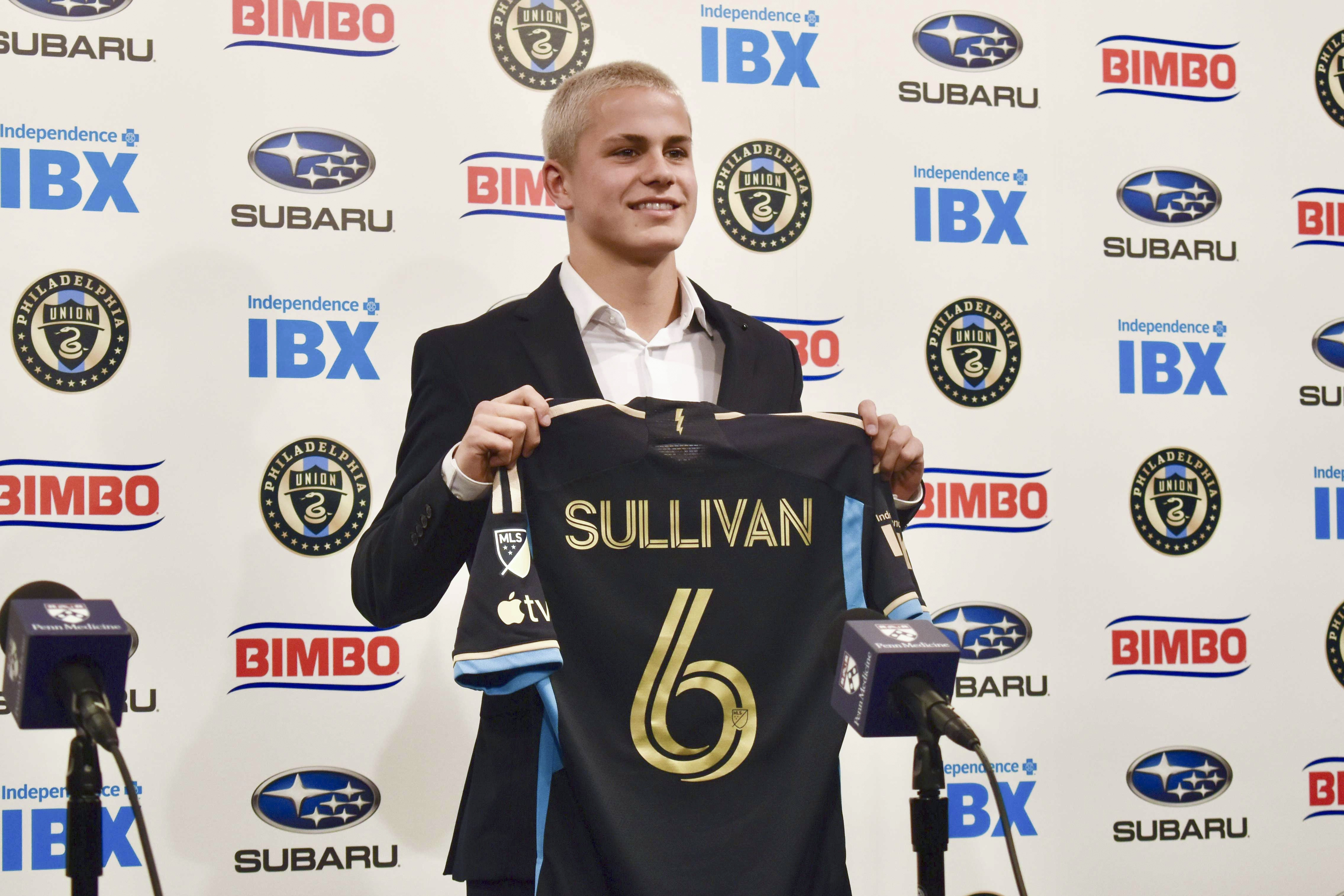 FILE - Philadelphia Union player Cavan Sullivan, 14, holds up his No. 6 jersey during an MLS soccer news conference at Subaru Park in Chester, Pa., May 9, 2024. Sullivan became the youngest player to appear in an MLS match on Wednesday night, July 17. 