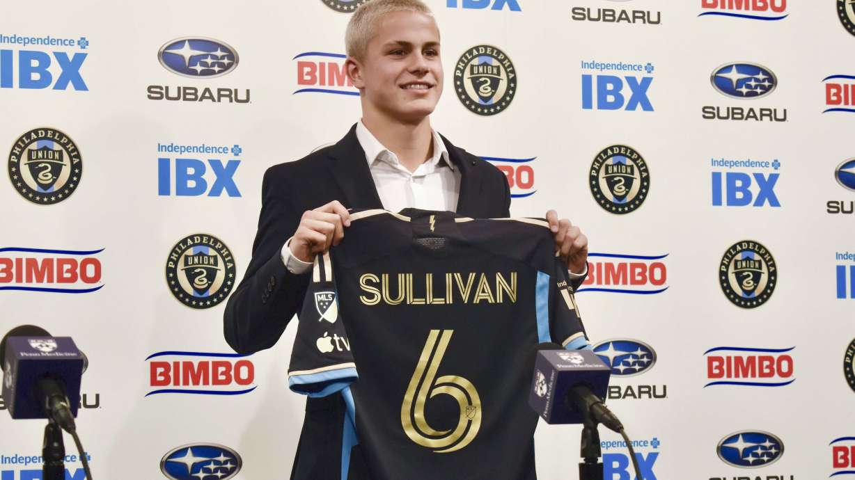 FILE - Philadelphia Union player Cavan Sullivan, 14, holds up his No. 6 jersey during an MLS soccer news conference at Subaru Park in Chester, Pa., May 9, 2024. Sullivan became the youngest player to appear in an MLS match on Wednesday night, July 17.