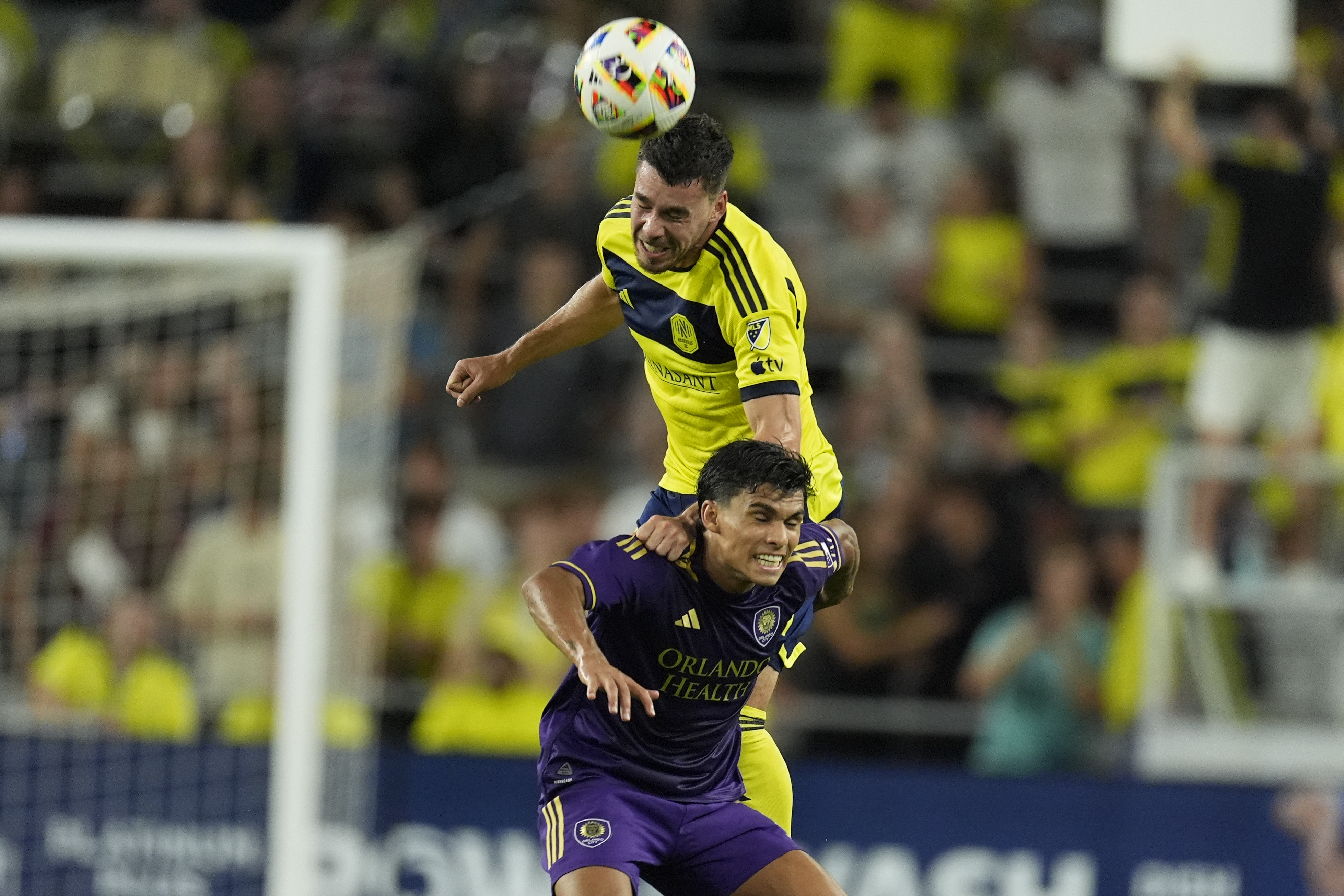 Nashville SC defender Daniel Lovitz, above, heads the ball over Orlando City forward Ramiro Enrique during the second half of an MLS soccer match Wednesday, July 17, 2024, in Nashville, Tenn. Orlando City won 3-0.