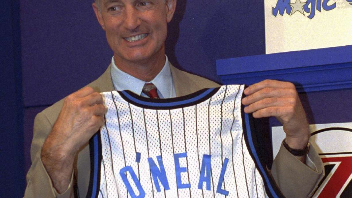 FILE - Orlando Magic President and General manager Pat Williams grins while holding up a jersey bearing the name O'Neal and the number 1, at the NBA draft lottery in Secaucus, N.J. May 17, 1992. Williams, a co-founder of the Orlando Magic and someone who spent more than a half-century working within the NBA, died Wednesday, July 17, 2024, from complications related to viral pneumonia, the team announced.