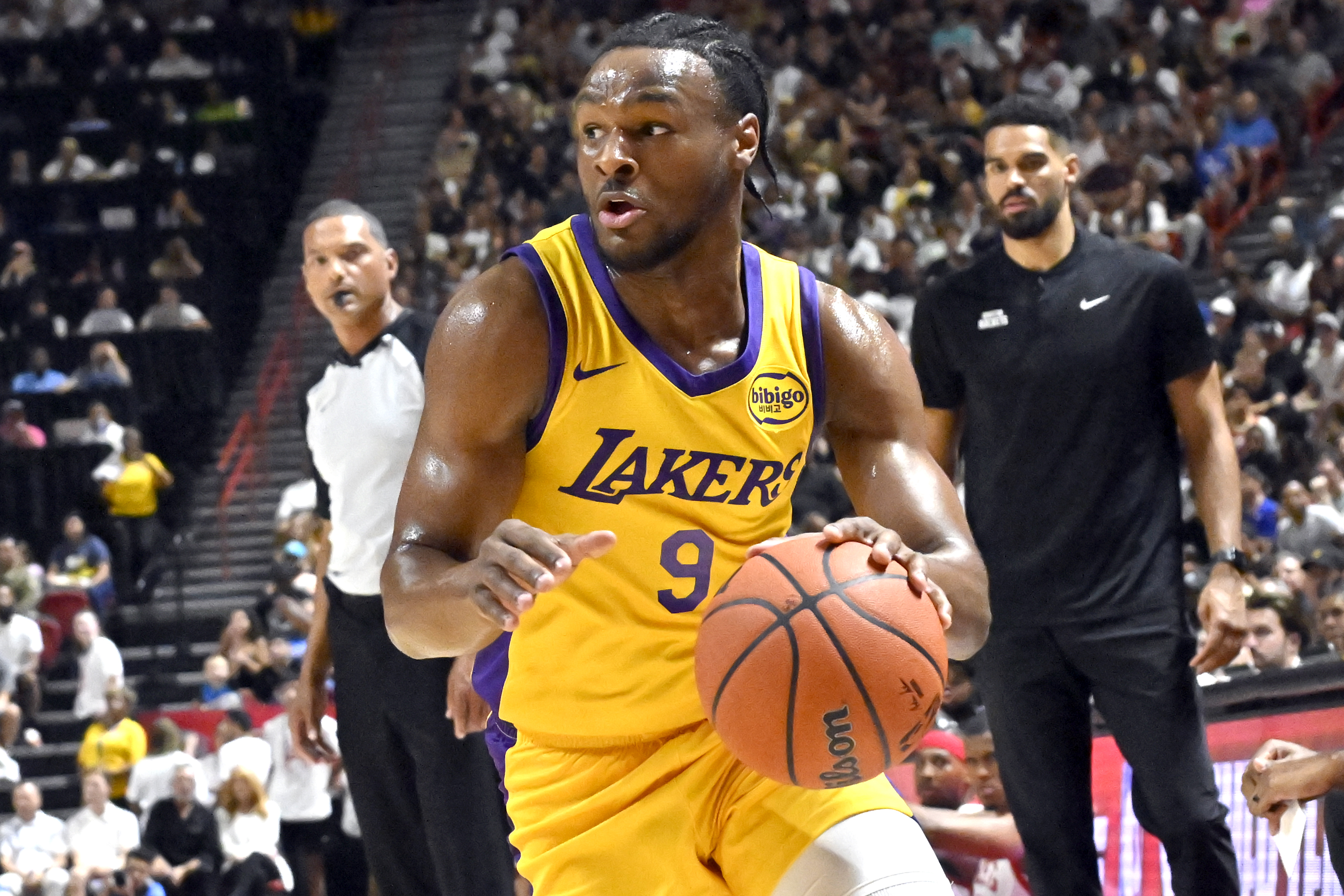 Los Angeles Laker guard Bronny James Jr. (9) drives the ball against the Houston Rockets during the first half of an NBA summer league basketball game Friday, July 12, 2024, in Las Vegas.