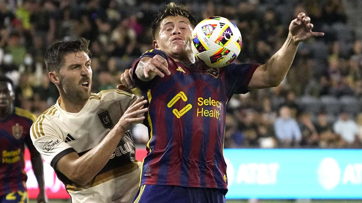 Real Salt Lake midfielder Diego Luna, right, controls the ball while under pressure from Los Angeles FC midfielder Ryan Hollingshead during the first half of a MLS soccer match Wednesday, July 17, 2024, in Los Angeles.