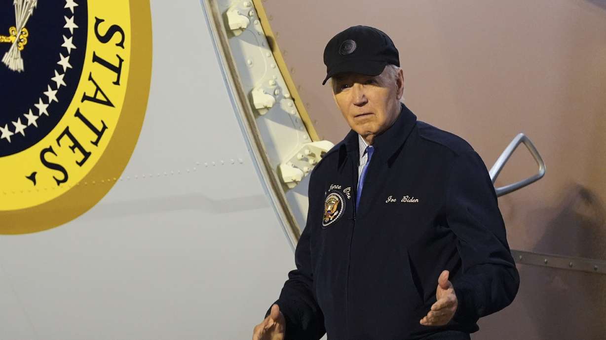 President Joe Biden walks down the steps of Air Force One at Dover Air Force Base in Delaware, Wednesday. Democrats at the highest levels — including former President Barack Obama and Speaker Emerita Nancy Pelosi — are making a critical push for Biden to reconsider his election bid. They worry Biden could lose the ability to seize control in the House if he didn't step away from the race.
