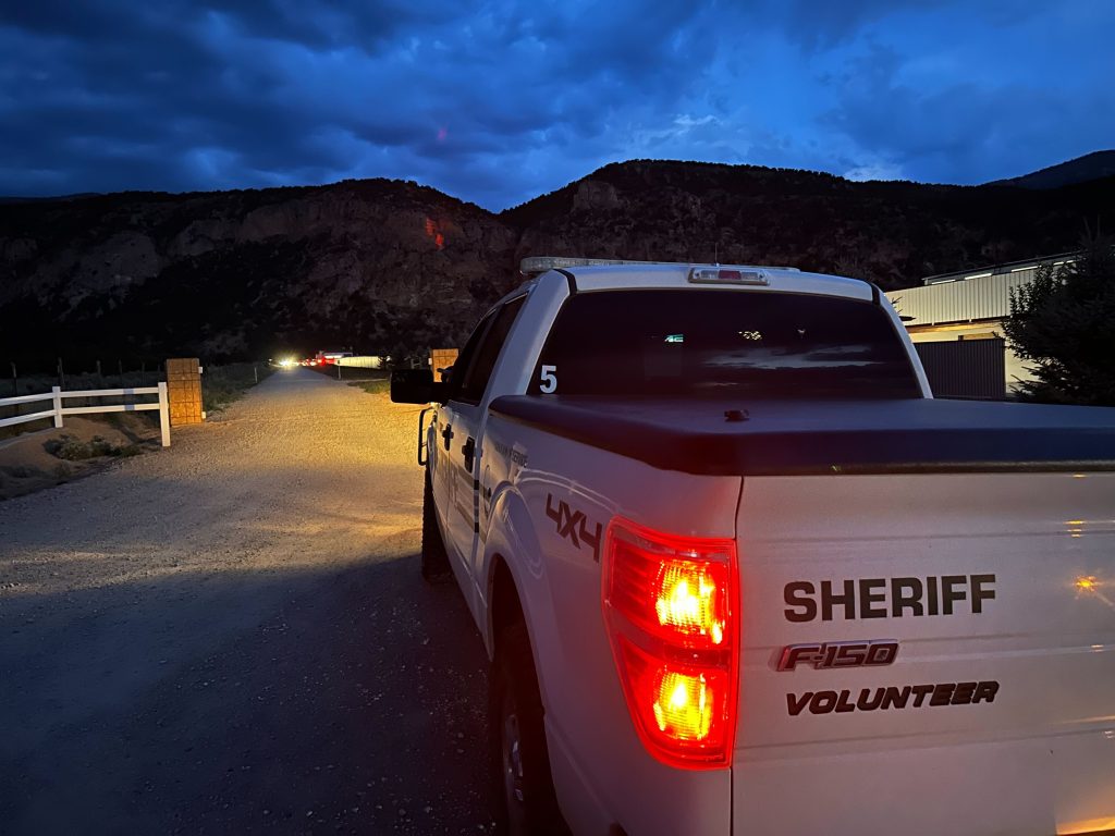 An Iron County sheriff’s volunteer vehicle restricts access to Golden Sunset Drive following the shooting death of a man in Kanarraville on Wednesday. 