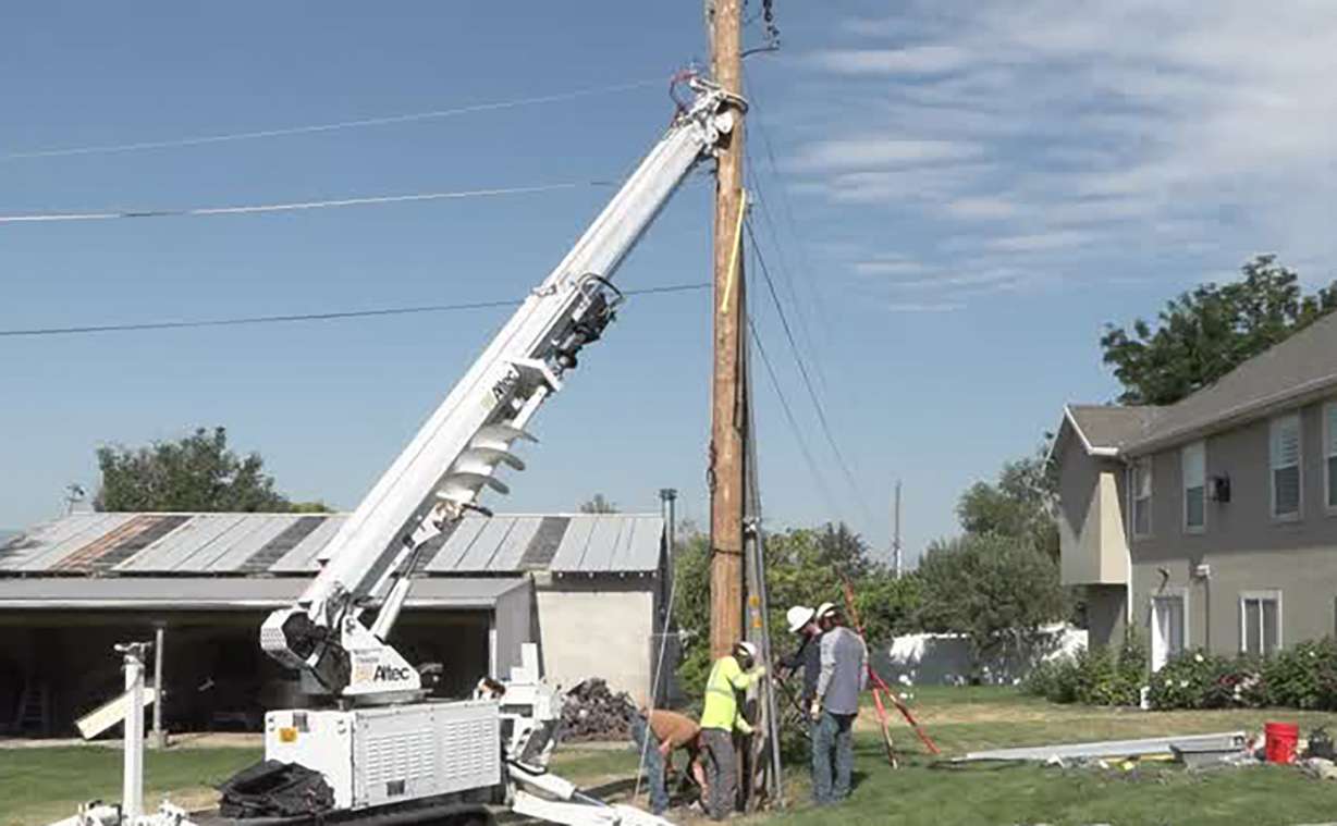 Crews work on a power line in Pleasant Grove on Wednesday during a planned power outage. Thousands of people across Utah have been without power recently and Rocky Mountain Power says many outages are triggered by fire sensors.