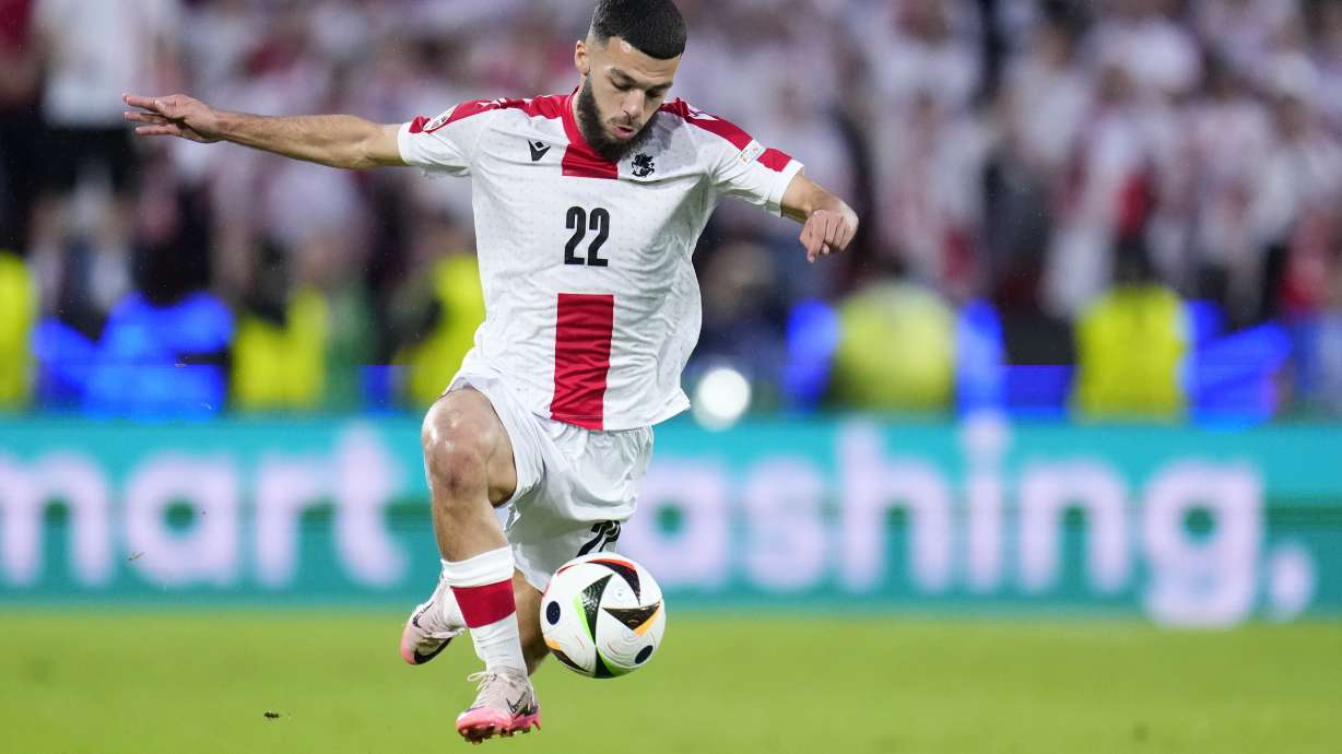 Georgia's Georges Mikautadze controls the ball during a round of sixteen match between Spain and Georgia at the Euro 2024 soccer tournament in Cologne, Germany, Sunday, June 30, 2024.