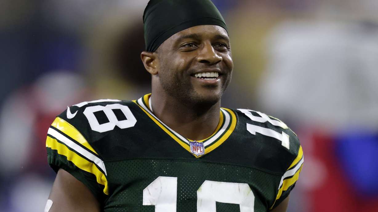 FILE - Green Bay Packers' Randall Cobb smiles as he walks off the field after an NFL football game against the Detroit Lions Monday, Sept. 20, 2021, in Green Bay, Wis. Th former Pro Bowl receiver has joined the SEC Network as a college football studio analyst after 13 NFL seasons spent mostly with the Packers.