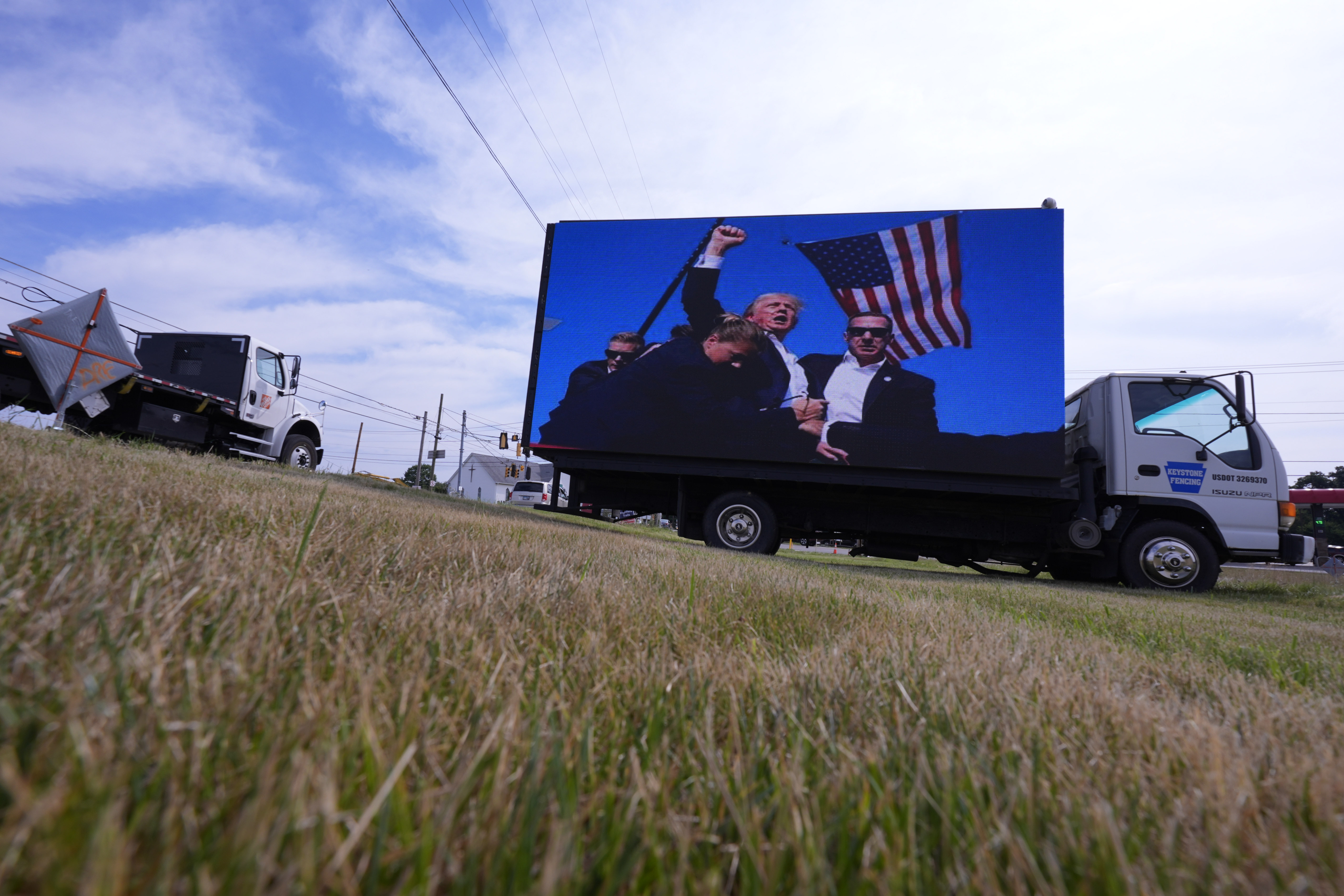 An electronic billboard displays images of former President Donald Trump from his recent rally at the Butler Farm Show, Thursday, in Butler, Pa. The man who tried to assassinate Trump had photos on his phone of the former Republican president, President Joe Biden and other officials.